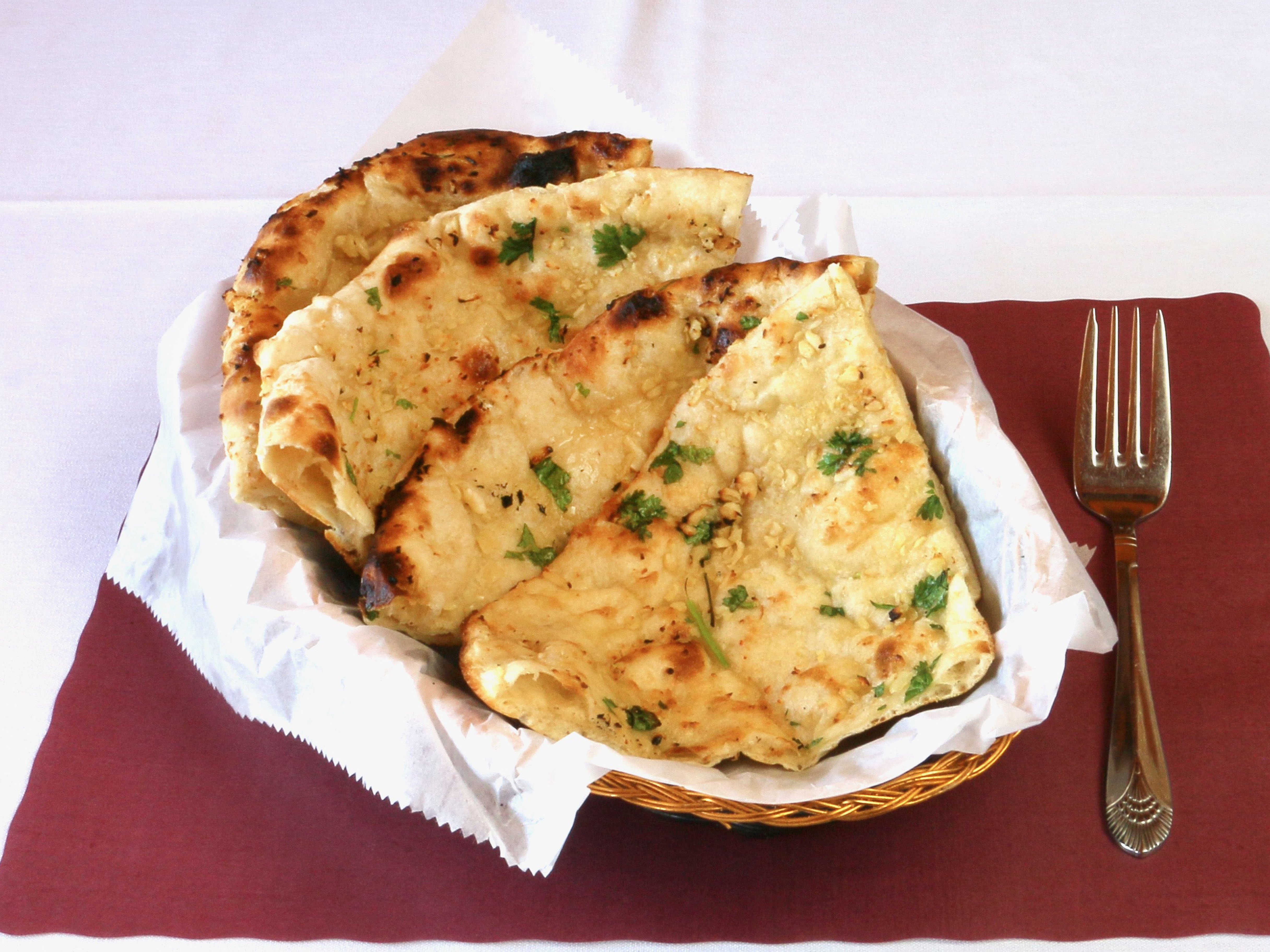Order Garlic Naan food online from Royal Kitchen store, Cockeysville on bringmethat.com