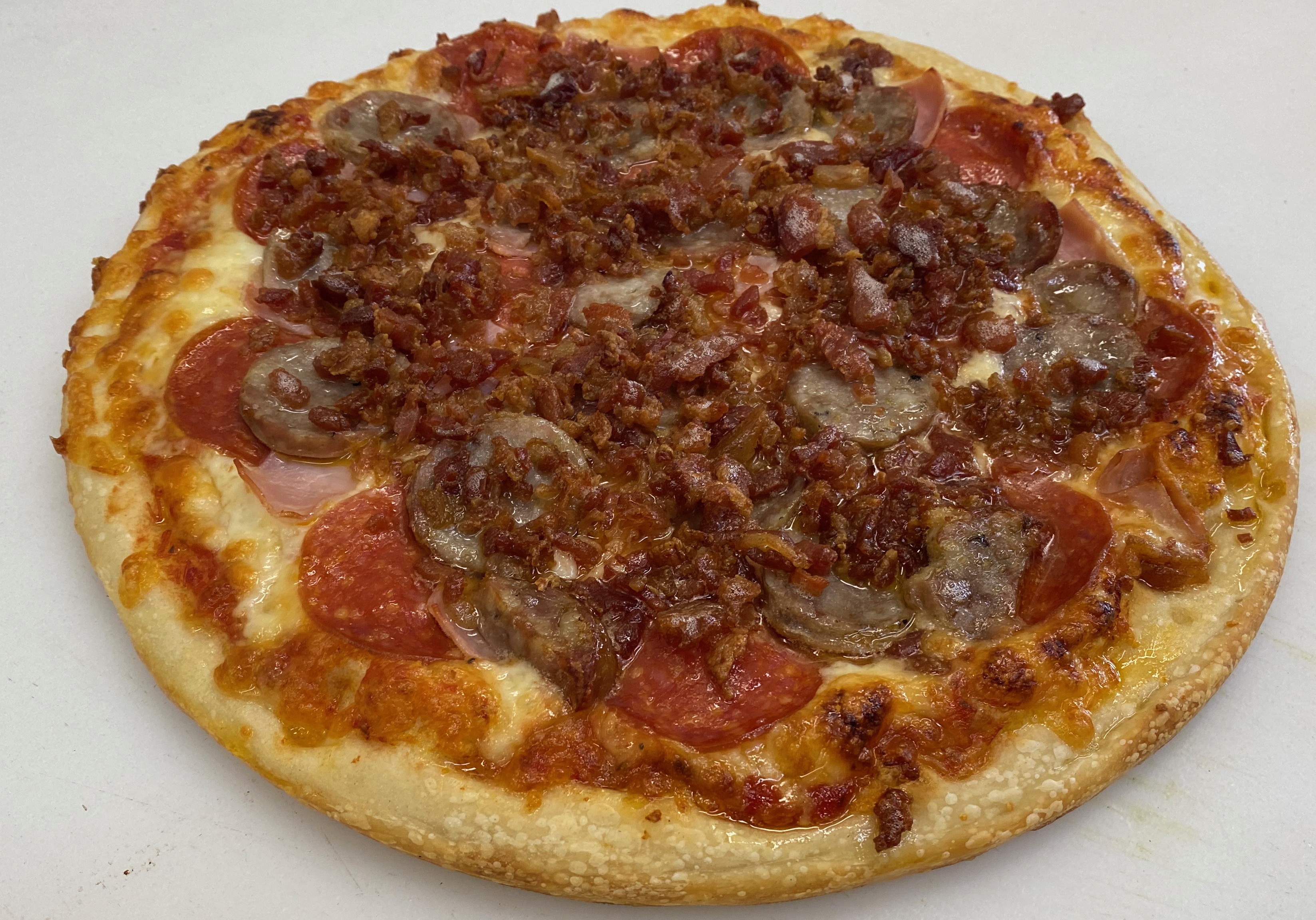 Order 18" Meat Lovers food online from Famous Pizza store, Paramus on bringmethat.com
