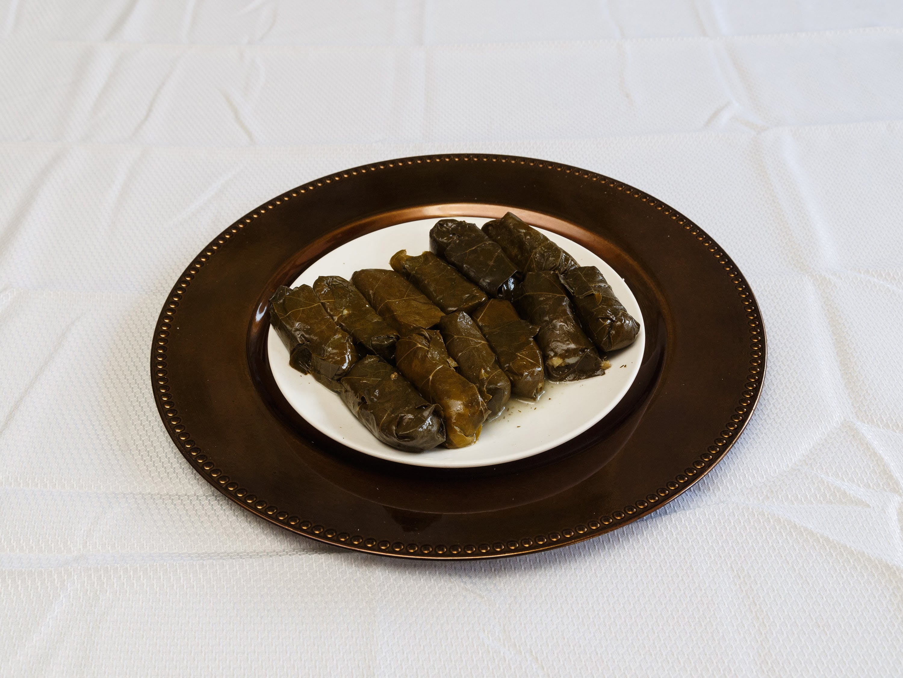 Order Stuffed Grape Leaves - 6 Pieces food online from Pizza Pronto store, Pittsburgh on bringmethat.com