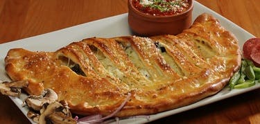 Order Cheese Calzone - Giant 12'' food online from Tuscan Sweets store, Menands on bringmethat.com