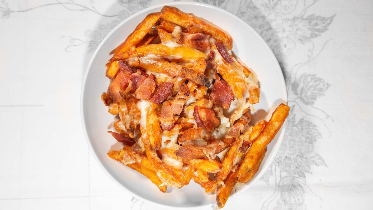 Order French Fries with Bacon and Cheese food online from Ricoy Pizzeria Restaurant store, Passaic on bringmethat.com