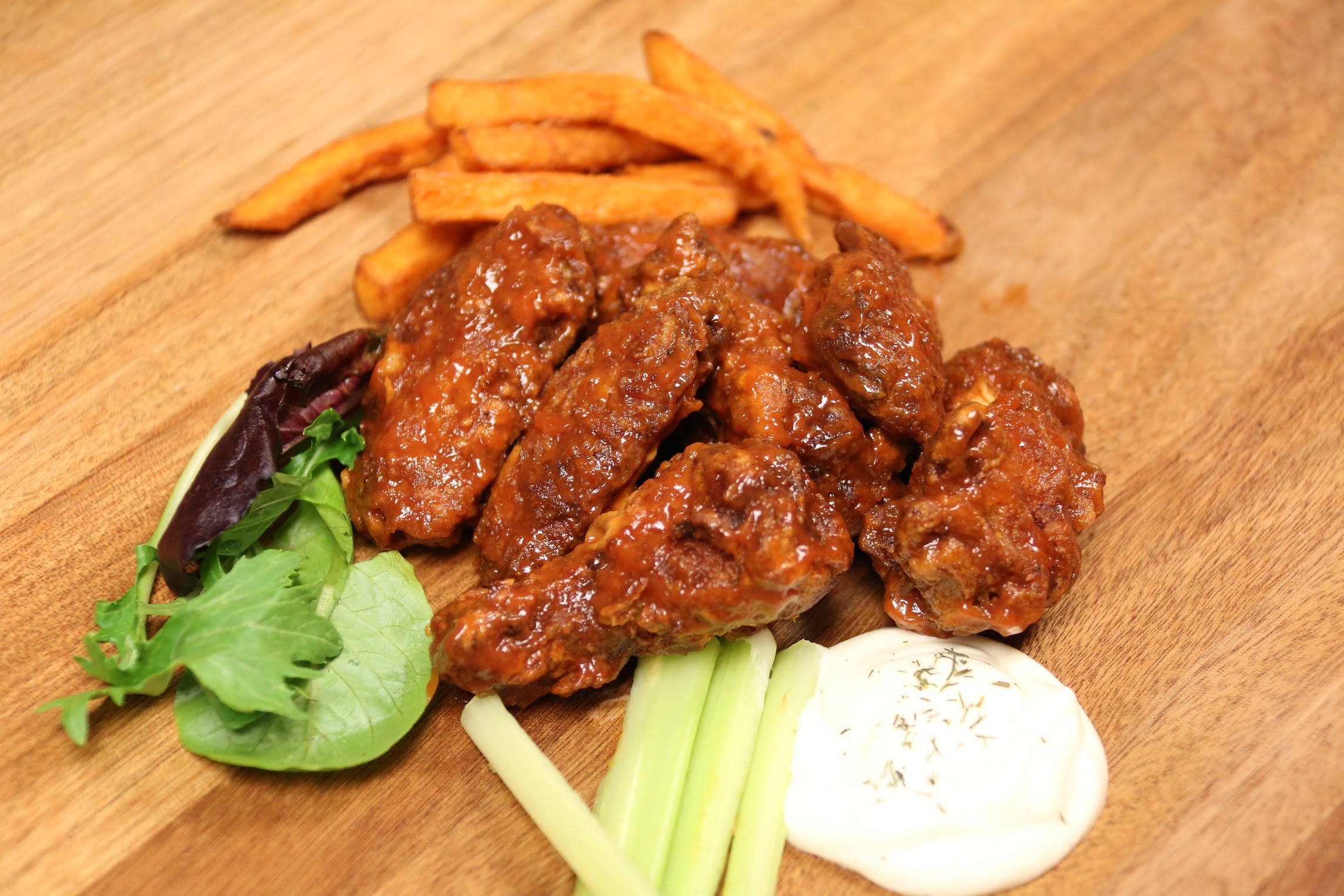 Order Spicy BBQ Wings food online from The Burger Joint store, New York on bringmethat.com