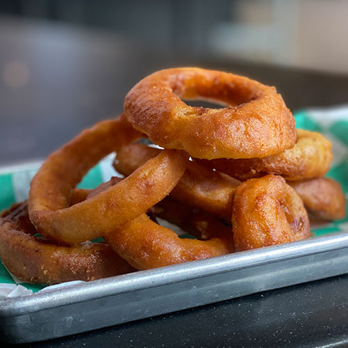 Order Thick Cut Beer Battered Onion Rings food online from Superburger store, Santa Rosa on bringmethat.com