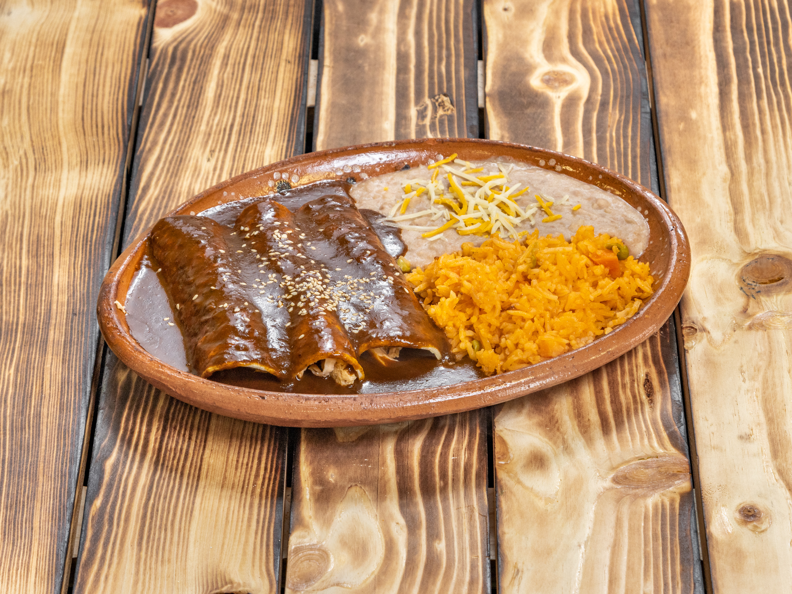 Order Enchilada de mole Lunch food online from Restaurant Y Tacos El Chino store, Dallas on bringmethat.com