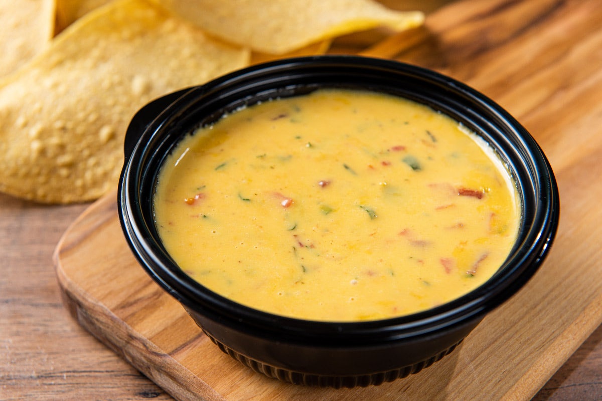 Order Queso food online from On The Border store, Arlington on bringmethat.com
