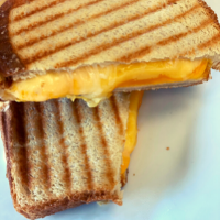 Order Loaded Grilled Cheese Sandwich food online from Simply Vanilla Gourmet store, Lynchburg on bringmethat.com