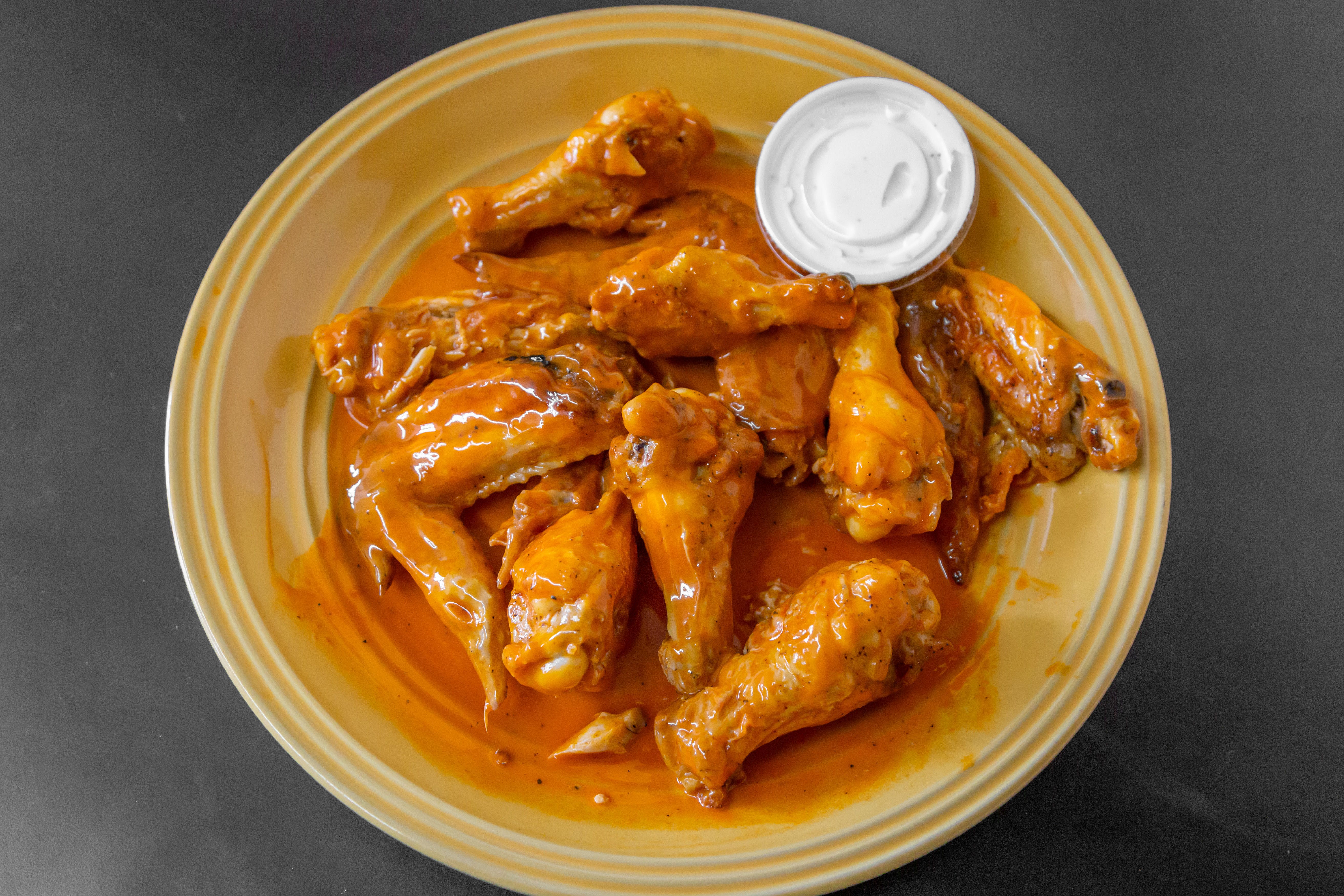 Order Bone In Wings - 10 Pieces food online from New York Pizzeria & Catering store, Dobson on bringmethat.com