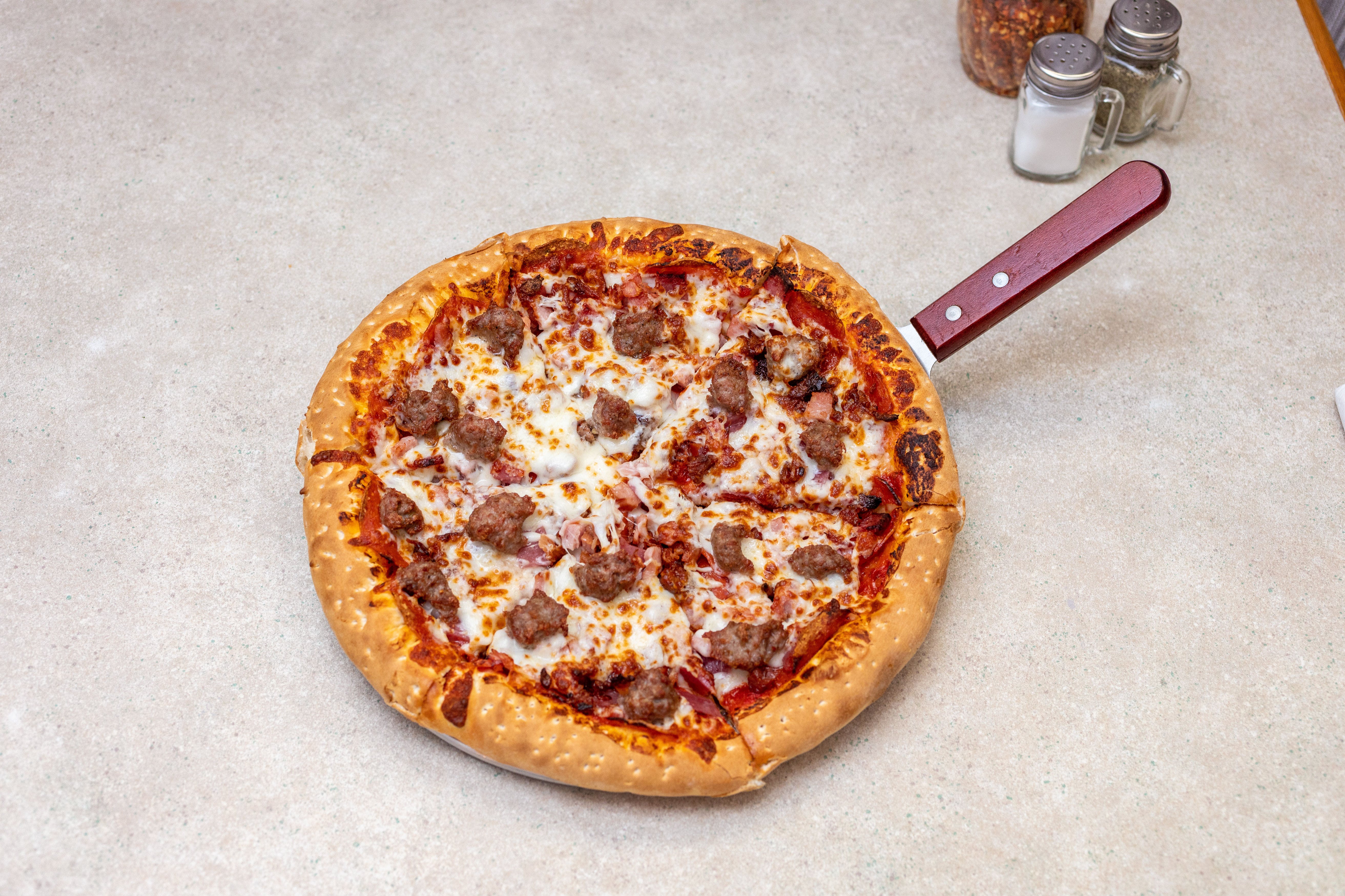 Order Carnivore Pizza - Mini 7" food online from Saucy's Pizza store, Littleton on bringmethat.com