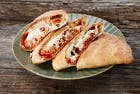 Order Big Wednesday Calzone - Small food online from Extreme Pizza store, Rohnert Park on bringmethat.com
