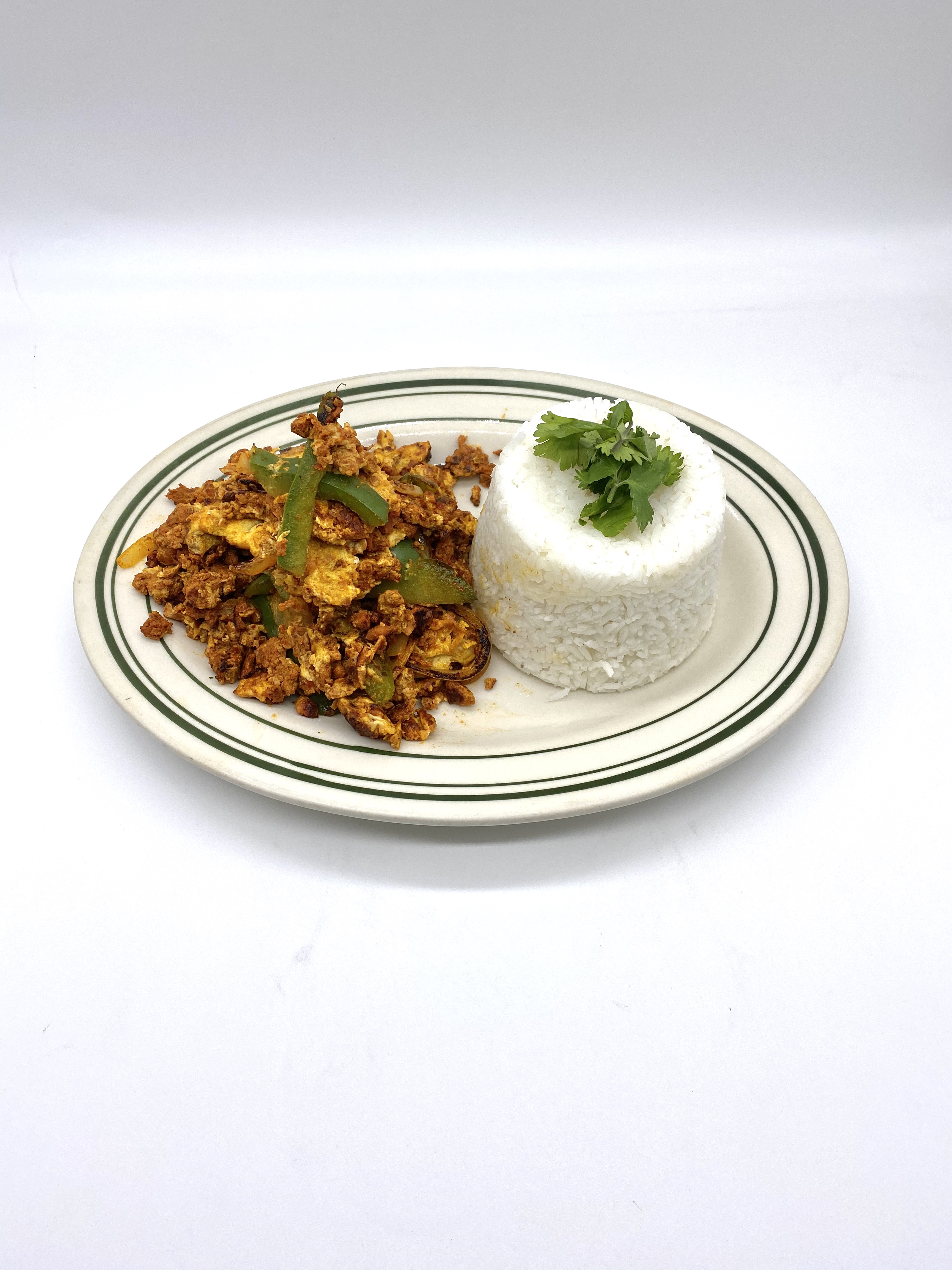 Order 21. Chorizo and Egg over Rice food online from Tacos Y Jugos Genesis store, Elmhurst on bringmethat.com