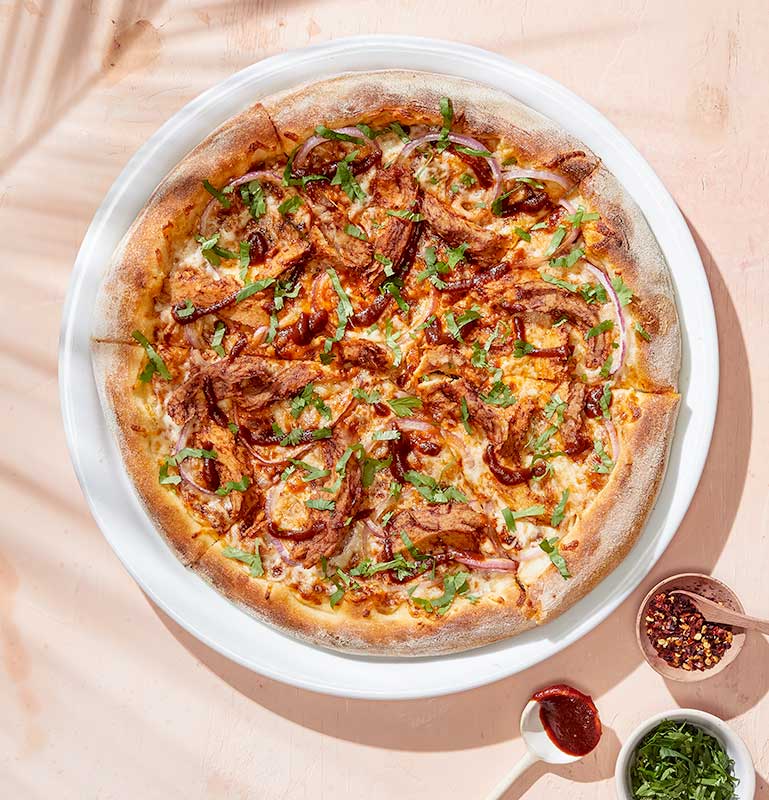 Order Plant-Based BBQ Chicken Pizza food online from California Pizza Kitchen - River City Dr store, Jacksonville on bringmethat.com