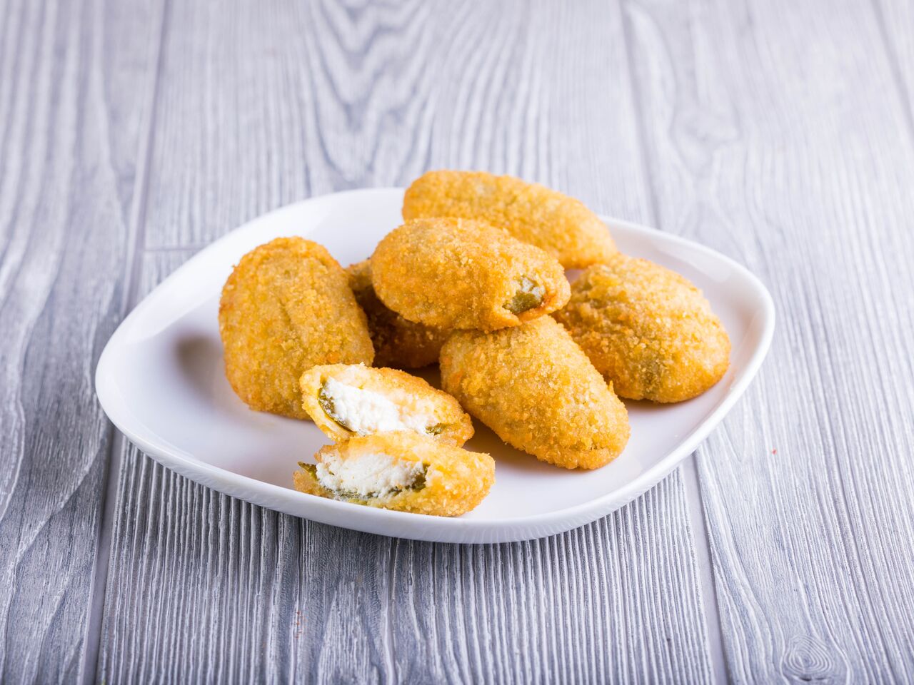 Order 7 Pieces Jalapeno Poppers food online from Gaslamp Pizza store, San Diego on bringmethat.com