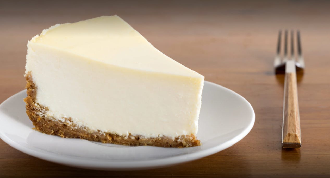 Order New York Style Cheesecake - Dessert food online from Olives Pizza & Grill store, Gainesville on bringmethat.com