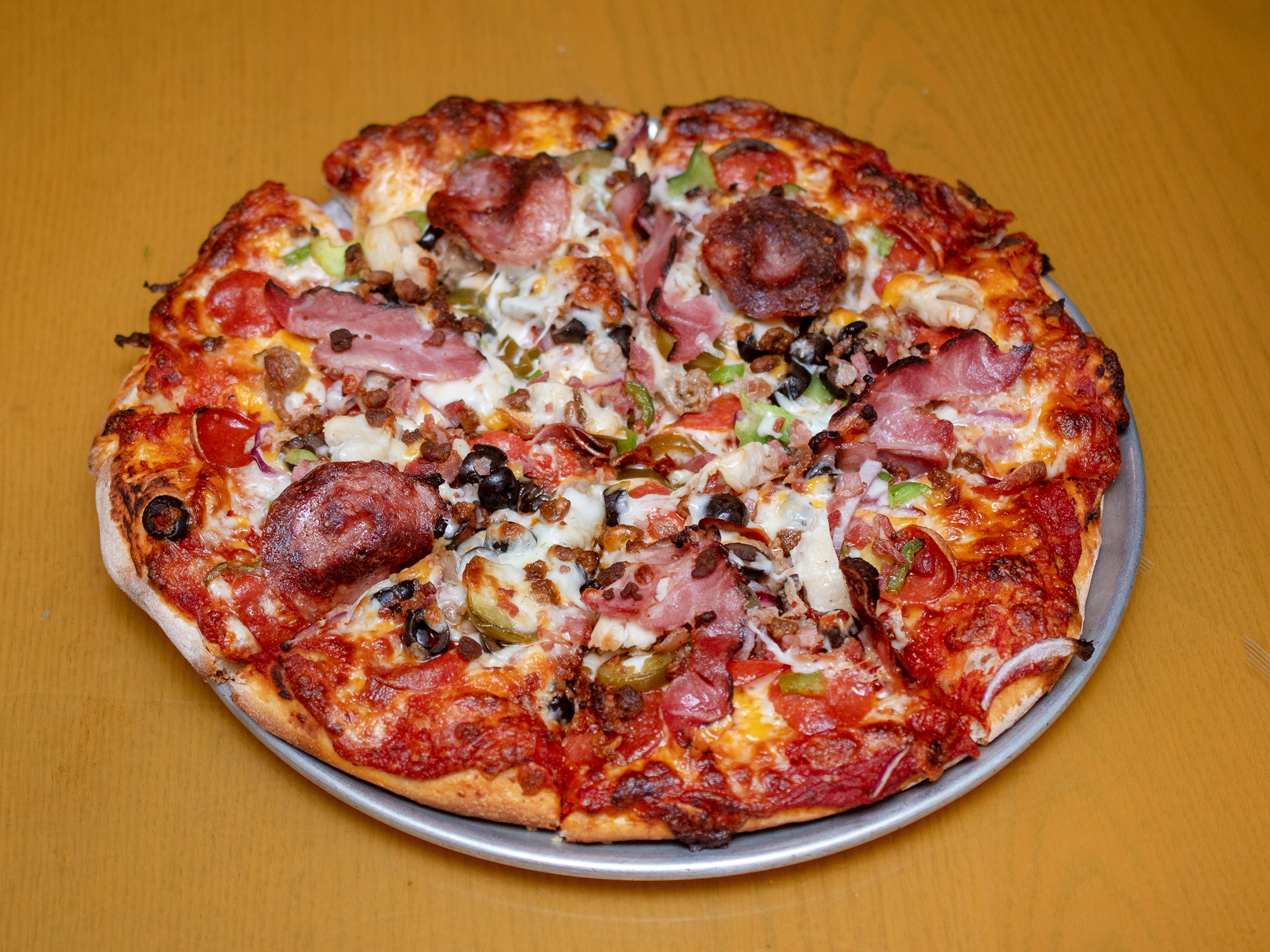 Order Meat Lover Pizza food online from Lucky J Pizza store, Auburn on bringmethat.com