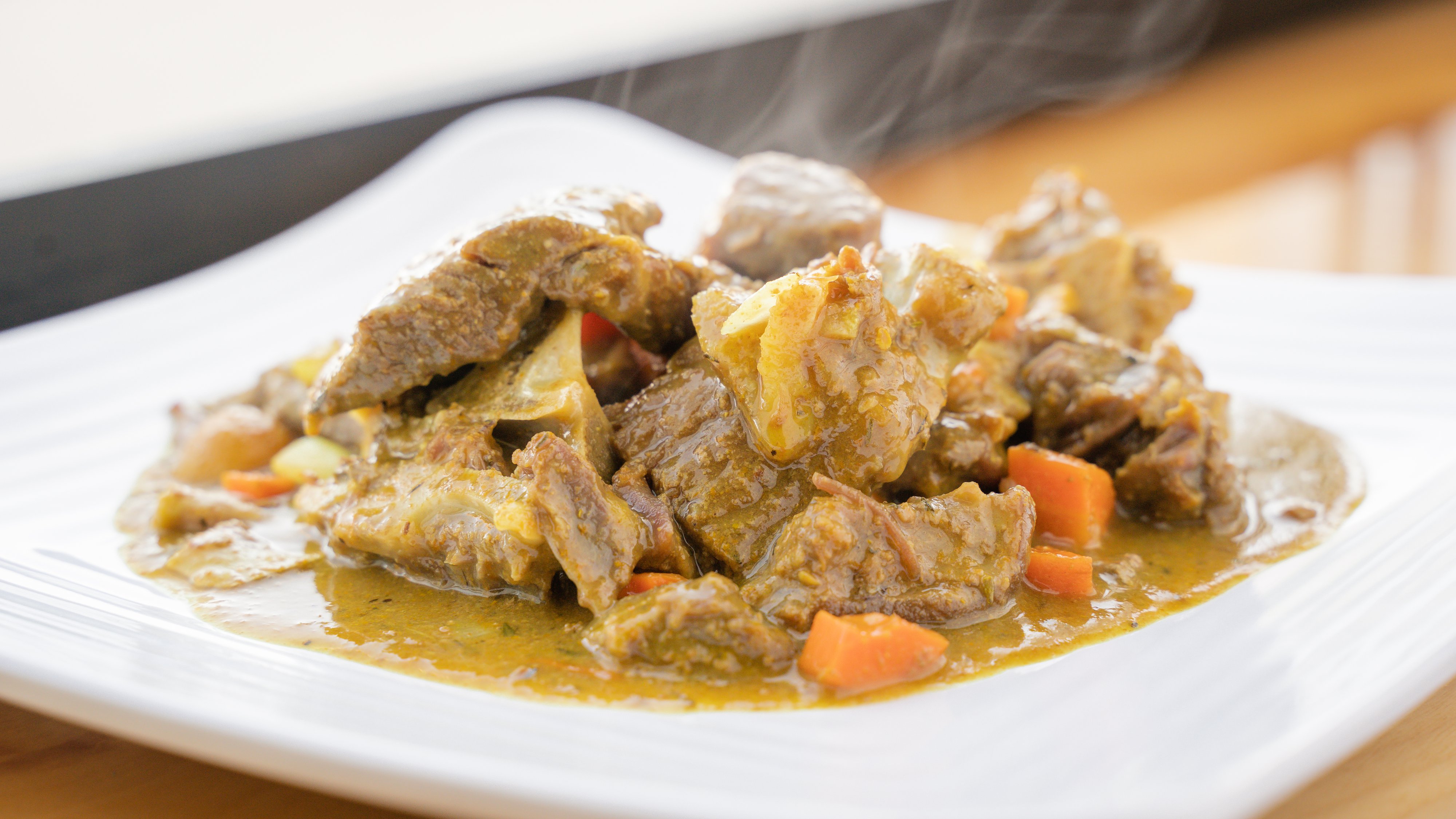 Order Authentic Curried Goat (Mutton)* food online from Jamaican Jerk & Bbq store, Denver on bringmethat.com
