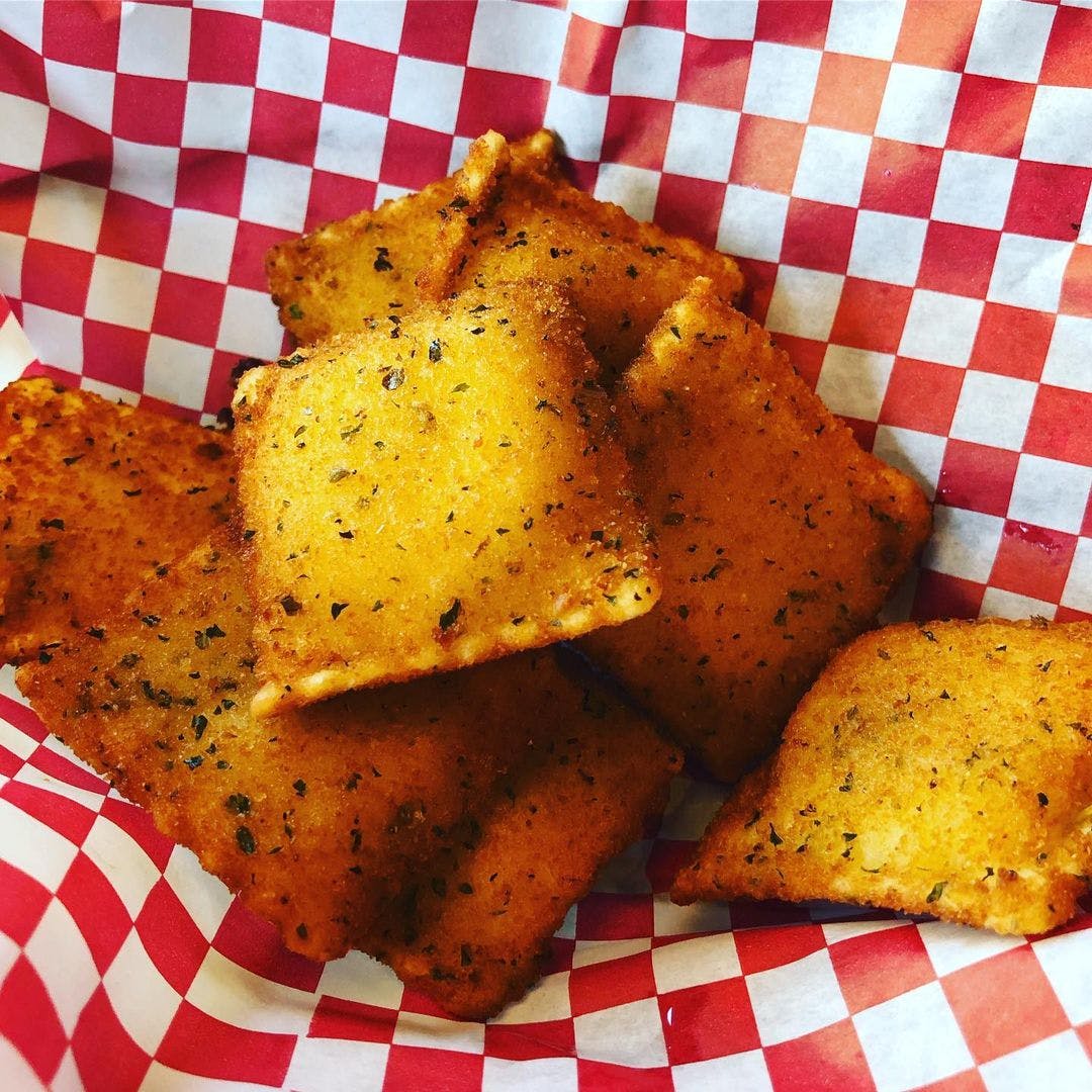 Order Four Cheese Toasted Ravioli - Appetizer food online from Aurelio's Pizza store, Chicago Heights on bringmethat.com