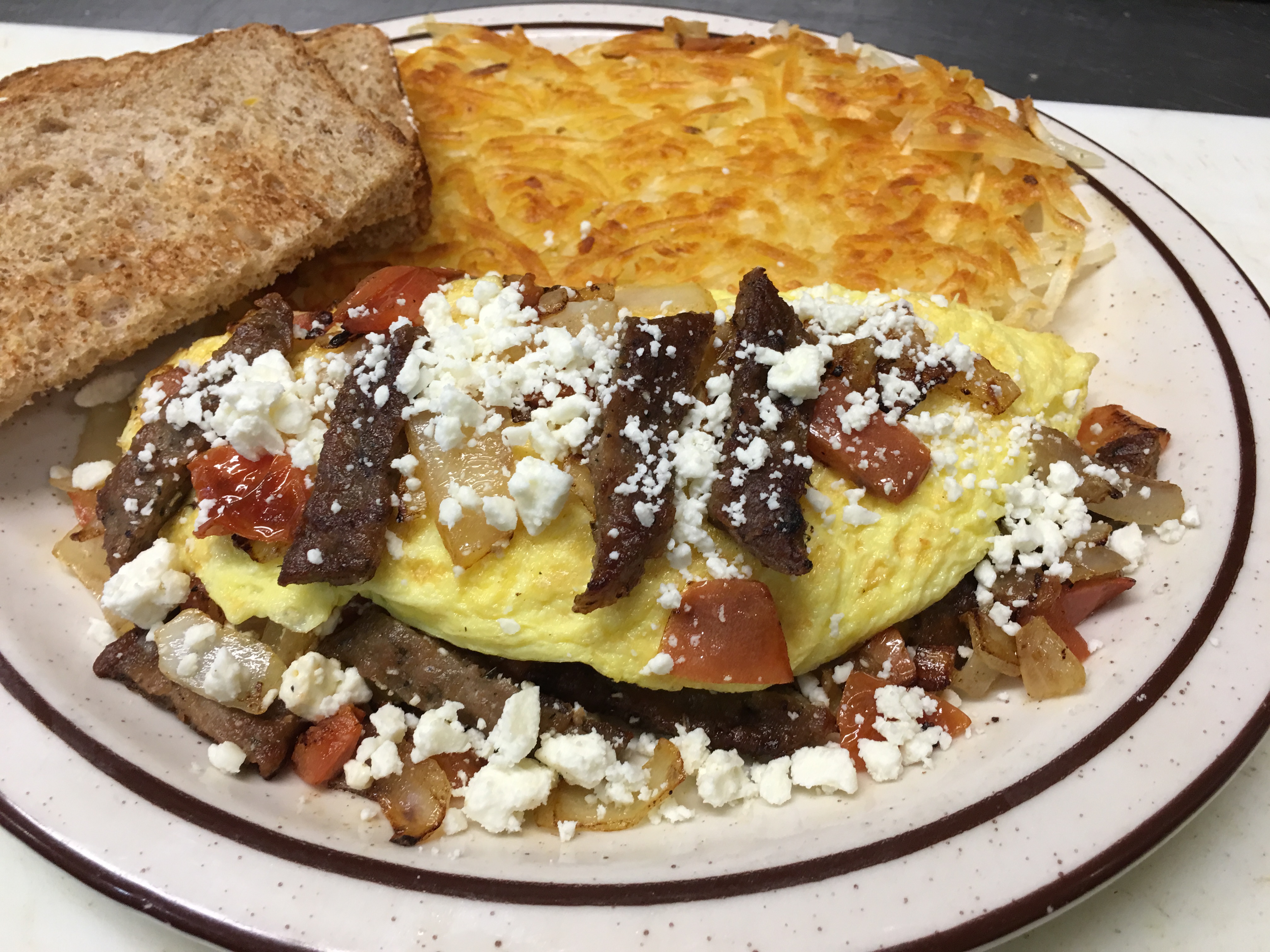 Order Greek Omelette food online from Neal Coffee Shop store, San Mateo on bringmethat.com