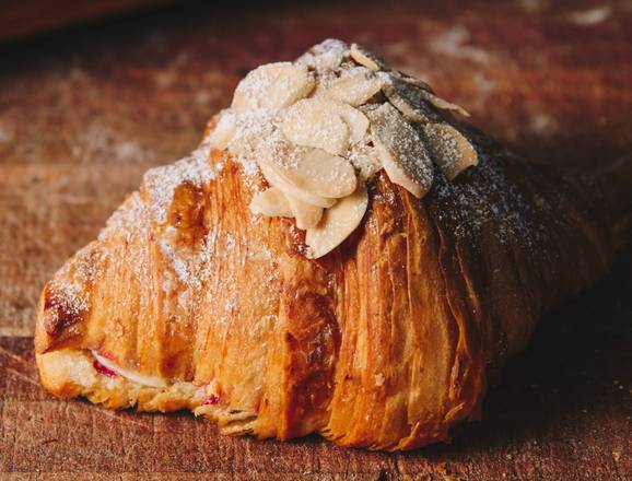 Order Almond raspberry croissant food online from Badolina Bakery &amp; Cafe store, Houston on bringmethat.com