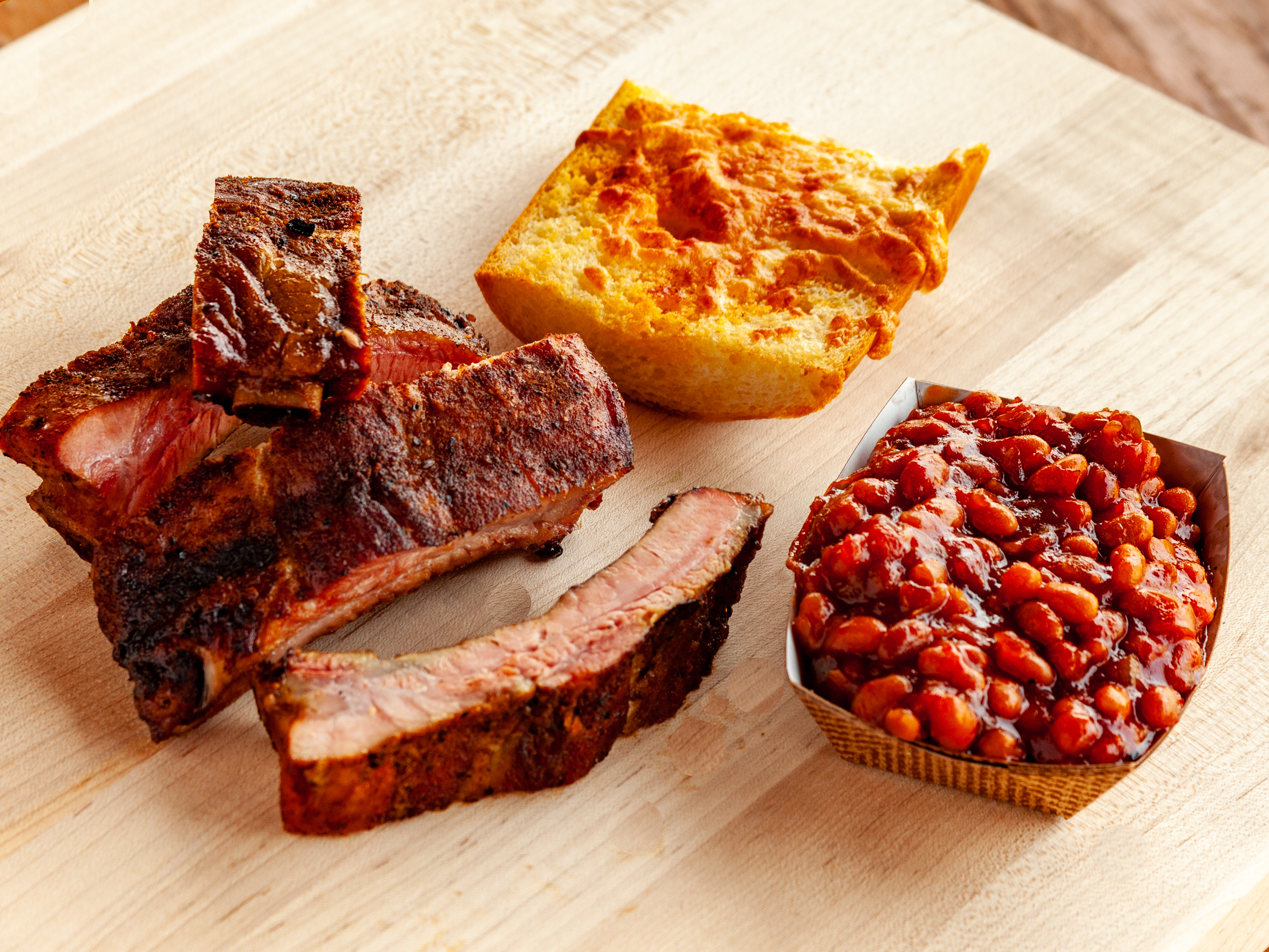 Order 4 Bone Ribs food online from Smokee Mo's St Louis BBQ store, Ballwin on bringmethat.com