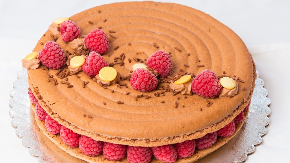 Order Raspberry Chocolate Macaron Cake food online from Le Macaron French Pastries store, Doylestown on bringmethat.com