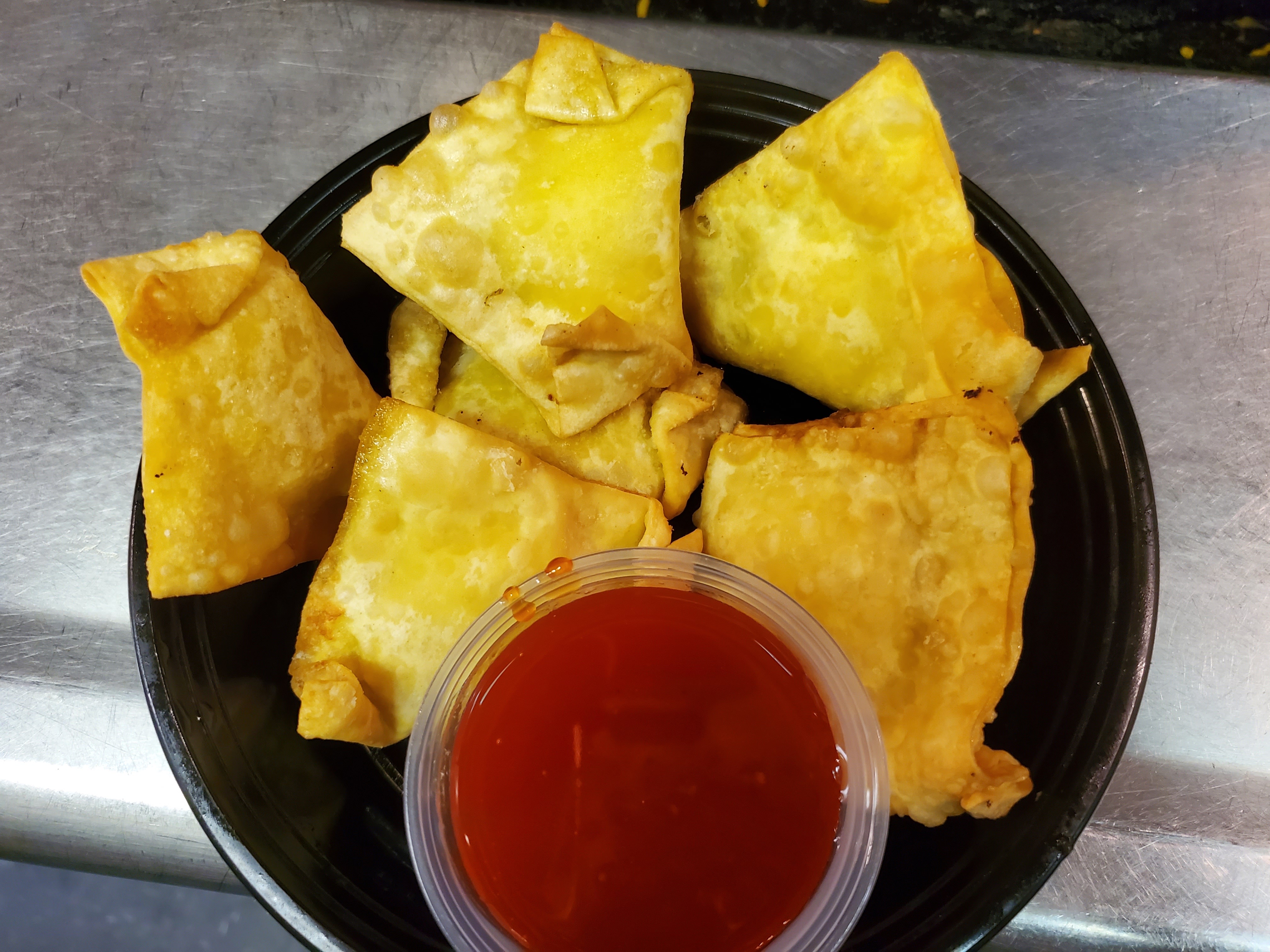 Order A14. Crab Meat Rangoon food online from China King store, Fayetteville on bringmethat.com