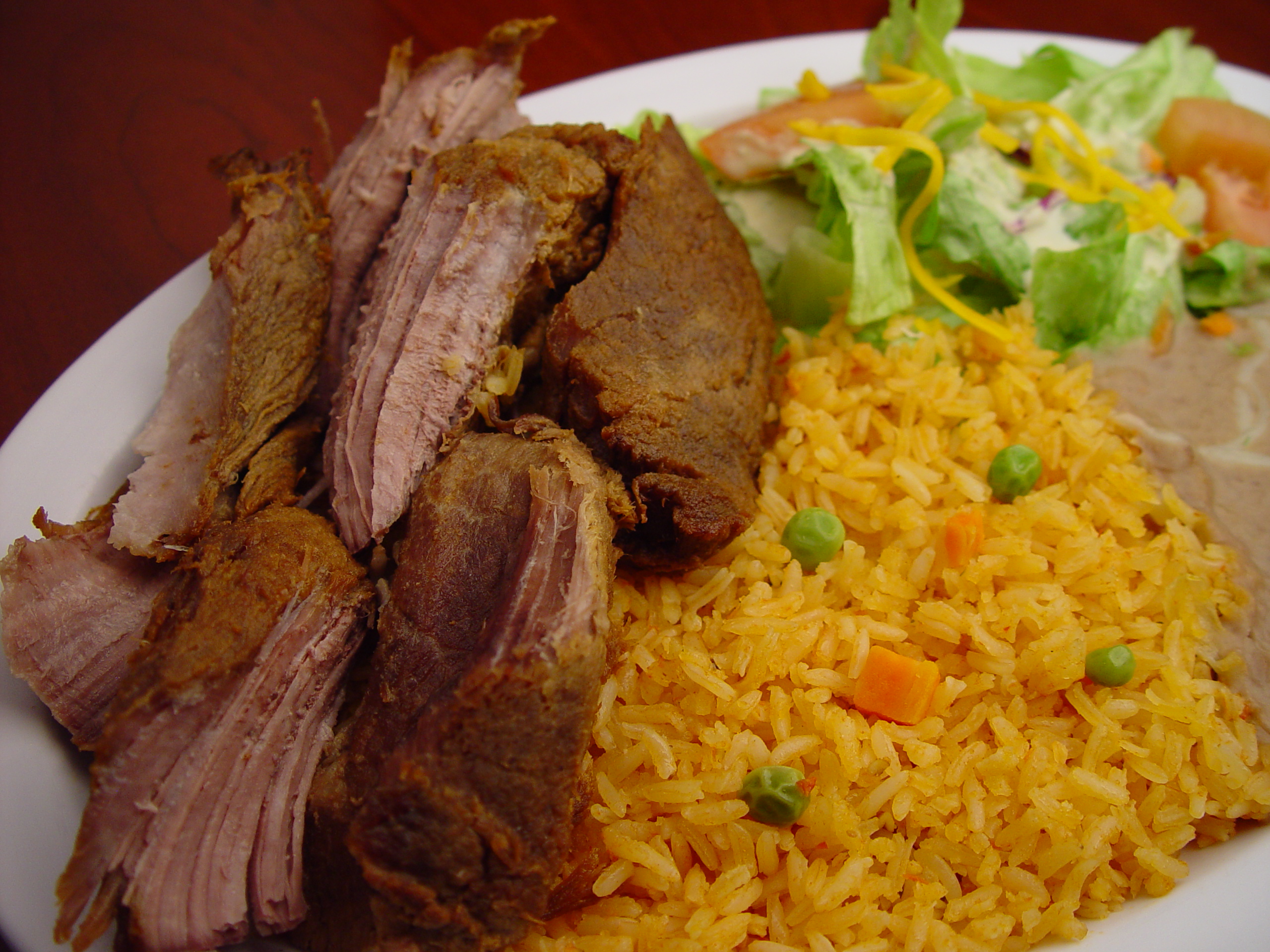 Order 46. Pork Carnitas Plate food online from Rodeo Mexican Grill store, Los Angeles on bringmethat.com