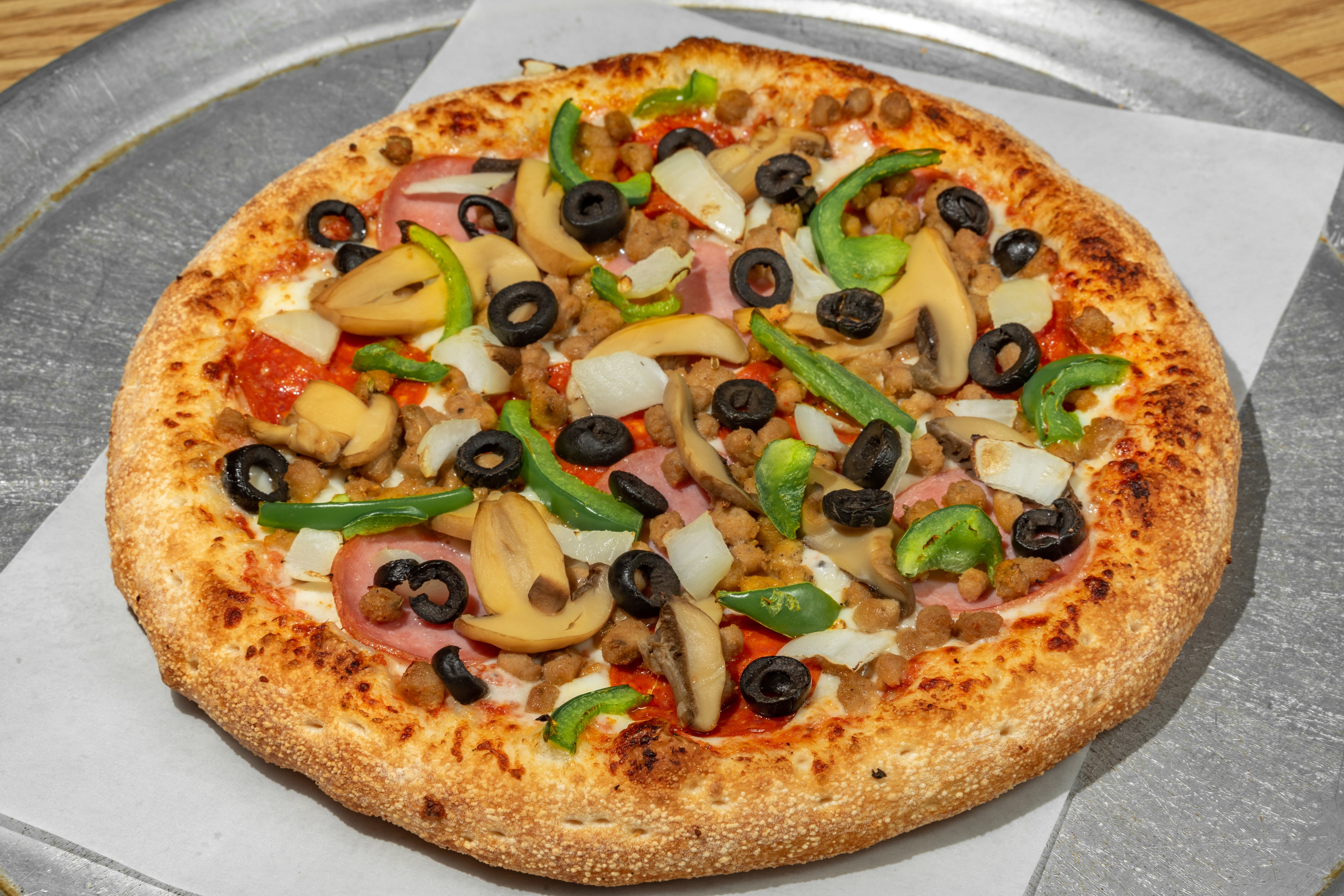 Order Super Special Pizza - Small 10'' food online from Rockyanos Pizza store, Dallas on bringmethat.com