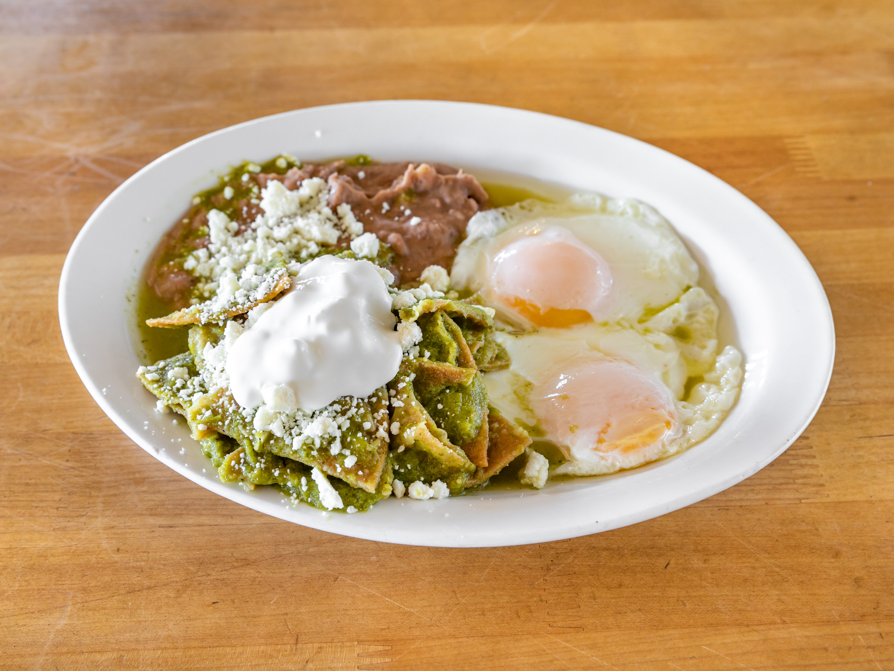 Order Chilaquiles Verdes con Huevos Breakfast food online from Casa Don Diego store, Chula Vista on bringmethat.com