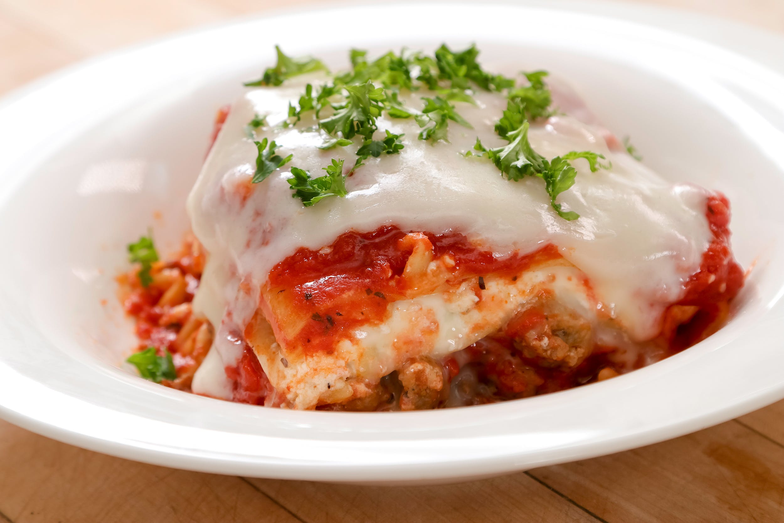 Order Baked Lasagna - Entree food online from Ameci Pizza & Pasta store, Camarillo on bringmethat.com