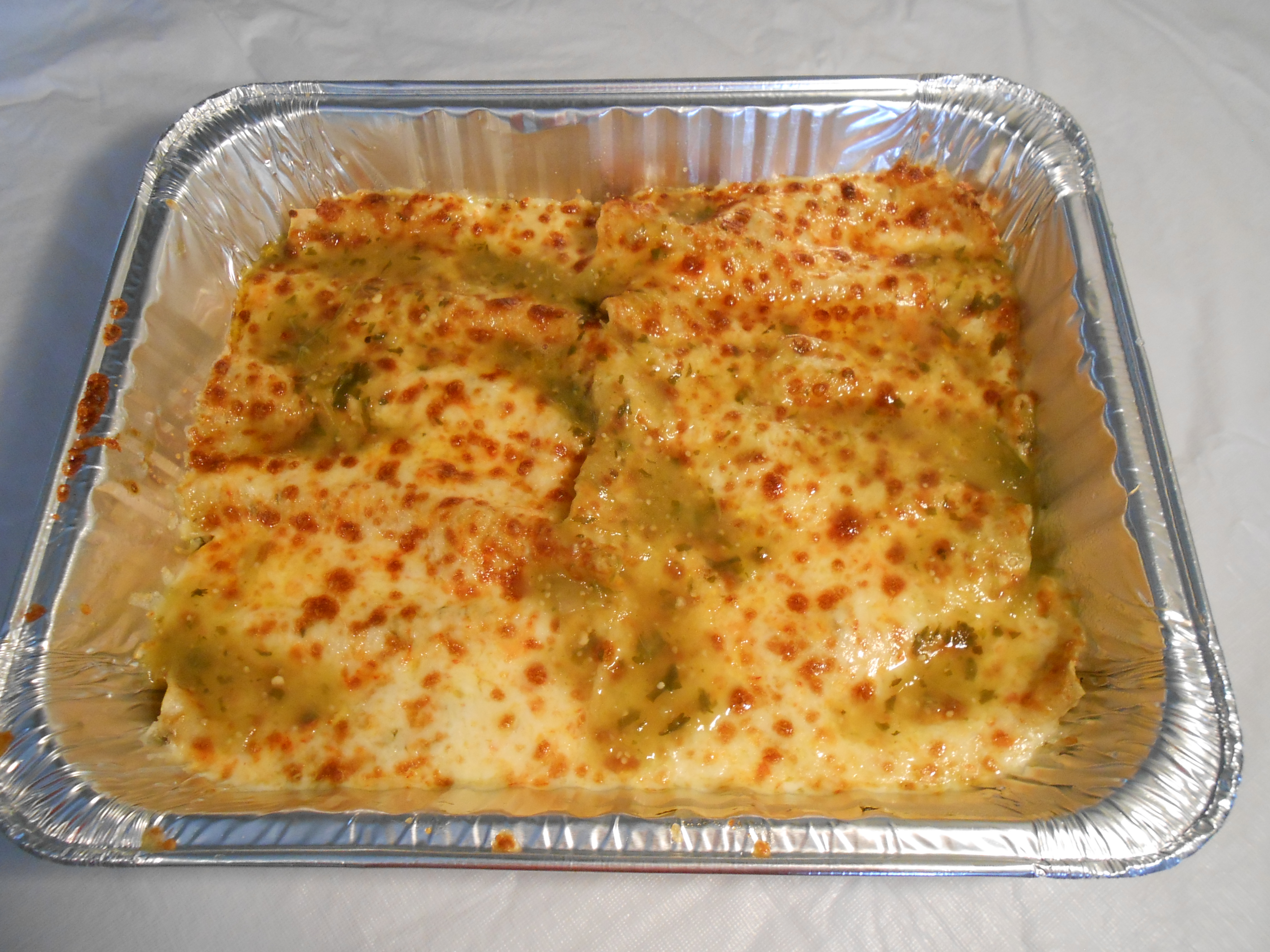 Order Enchiladas 1/2 Tray food online from Papacito's Mexican Grille & Catering Service store, Chicago on bringmethat.com