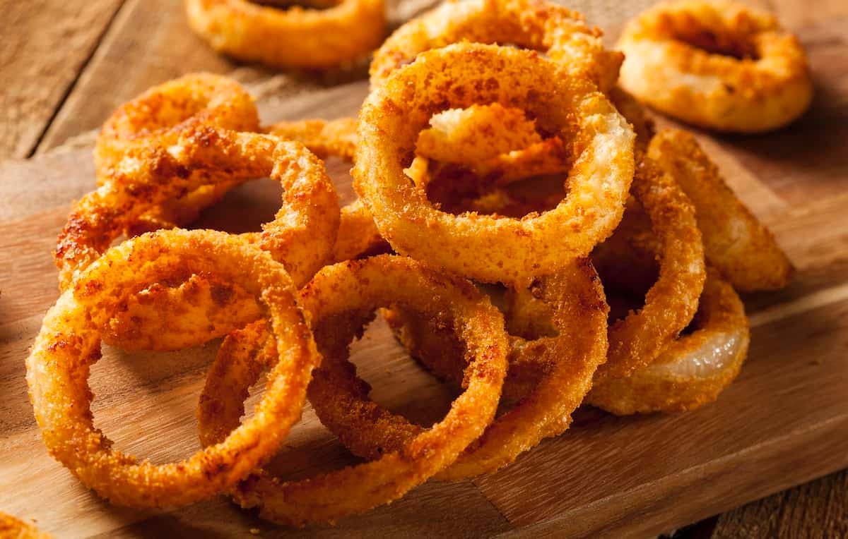 Order Onion Rings - Side food online from Niko's Pizza House store, Worcester on bringmethat.com