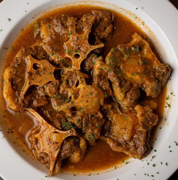 Order Oxtail Stew food online from Dominican Restaurant 4 store, Farmingdale on bringmethat.com