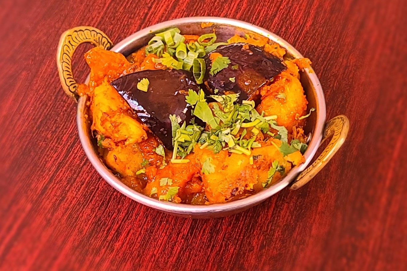Order Aloo Baingan food online from Om Indian Cuisine store, San Francisco on bringmethat.com