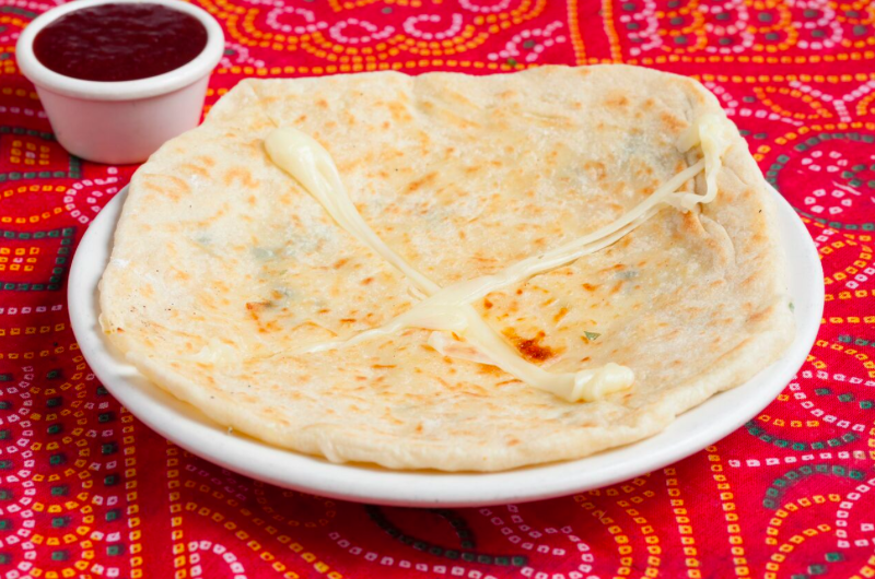 Order Cheese Naan food online from All India Cafe store, Pasadena on bringmethat.com