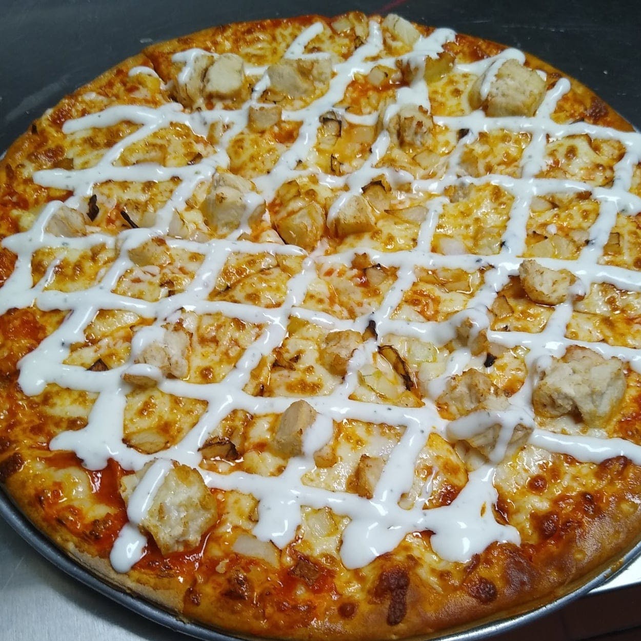 Order Chicken Ranch Style Pizza - Medium 12" (Serves 2-3 People) food online from Water Street Pizzeria store, Henderson on bringmethat.com