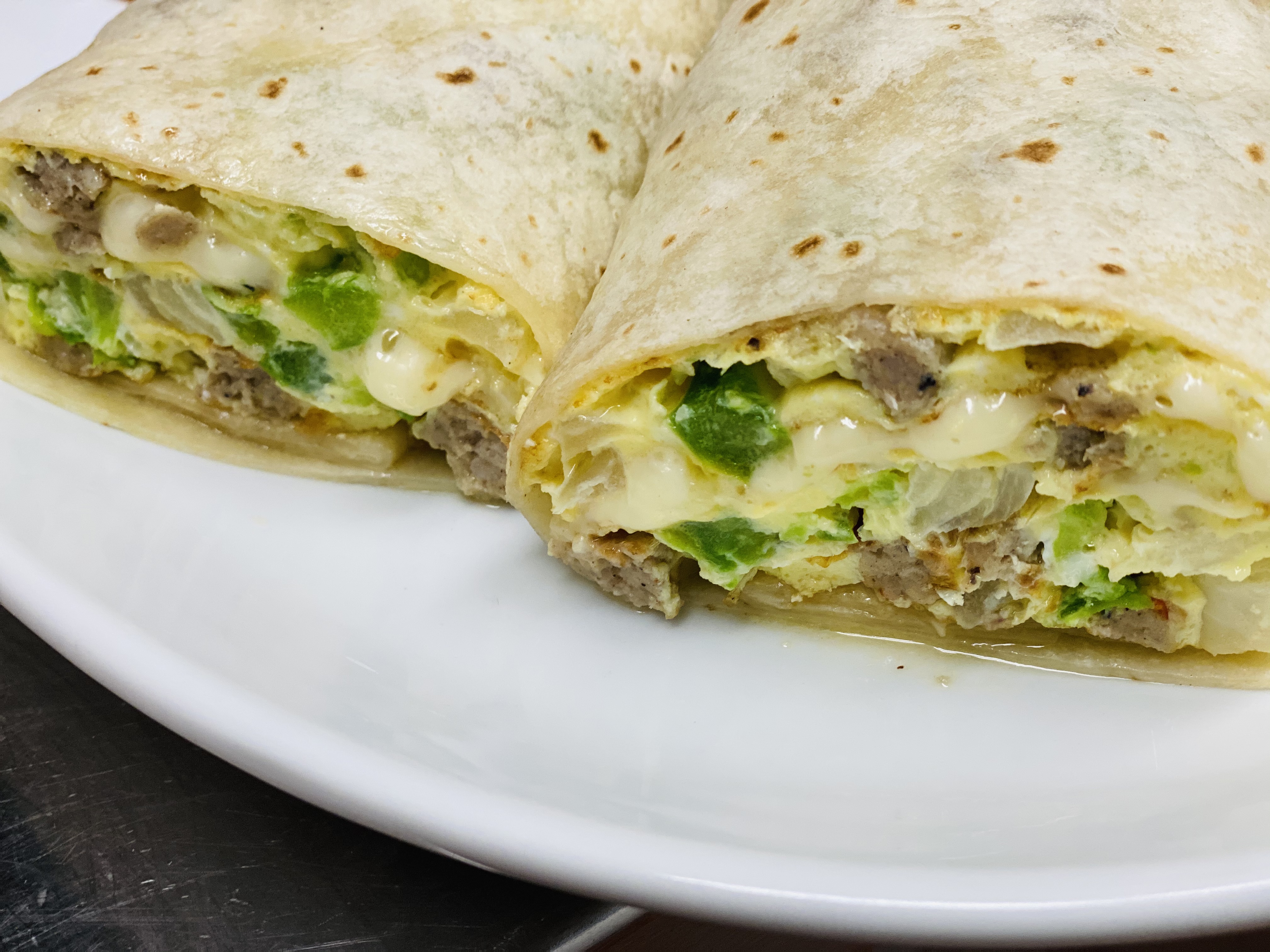 Order Ssc's Signature Burrito food online from State Street Cafe store, North Haven on bringmethat.com