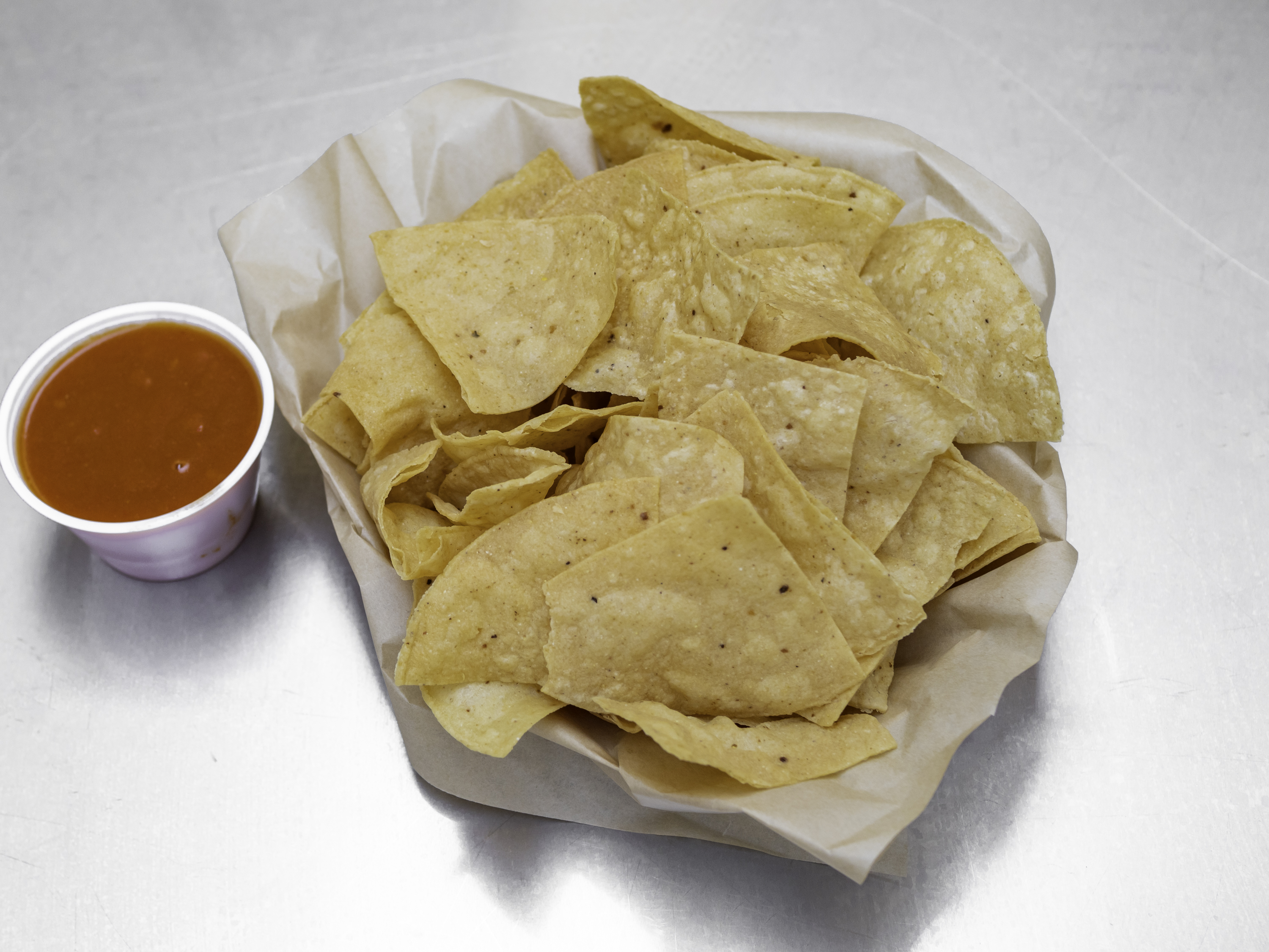 Order Chips & Enchilada Sauce food online from Burrito Boy 11th Ave store, Eugene on bringmethat.com