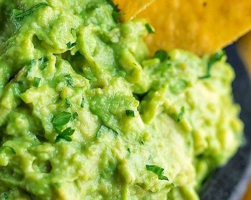Order Guac + Chips ** (Large, 8 oz) food online from Chicho’s Cocina store, Stamford on bringmethat.com