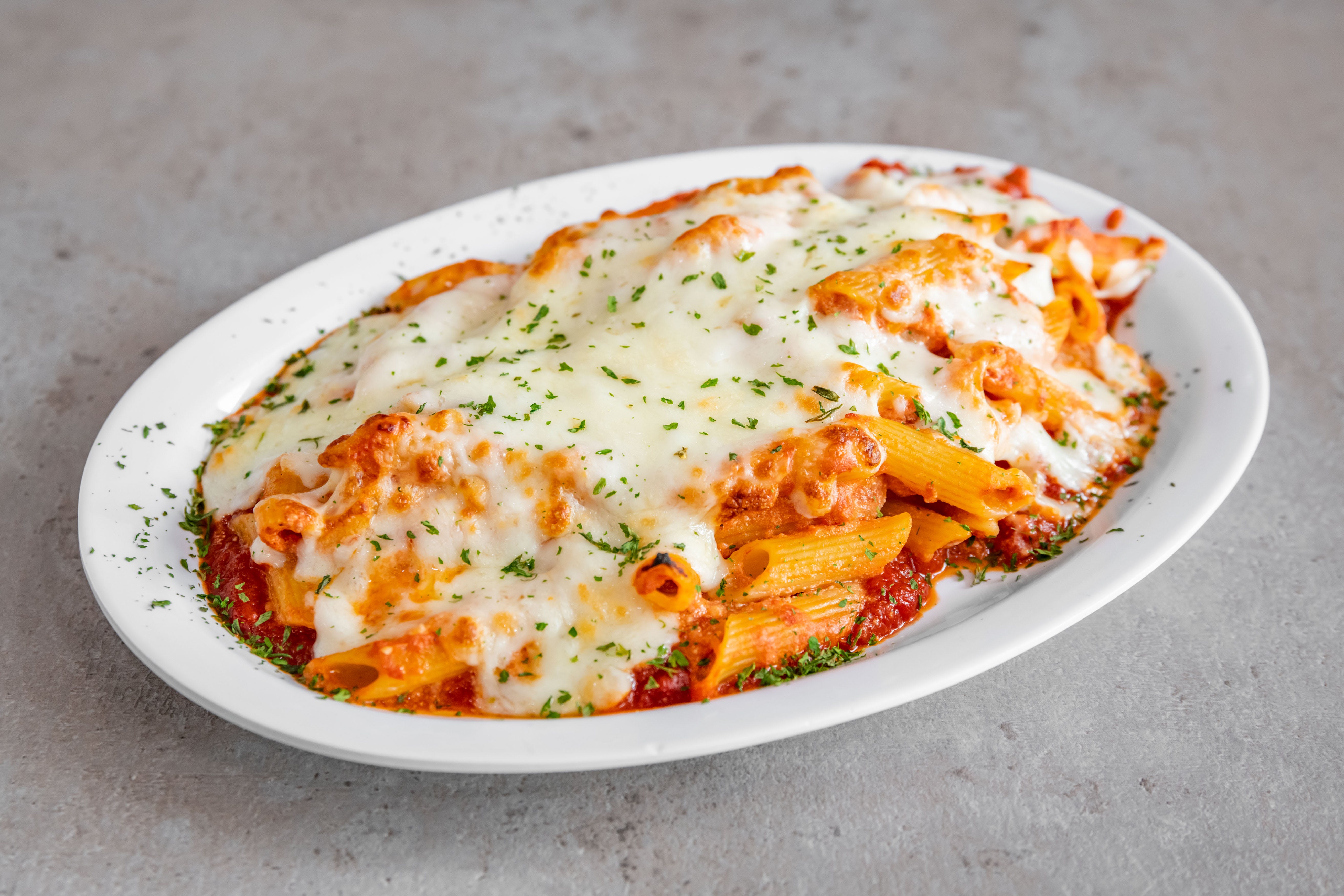 Order Baked Ziti - Baked Ziti food online from Scuotto's Pizza and Pasta Inc. store, Sunrise on bringmethat.com