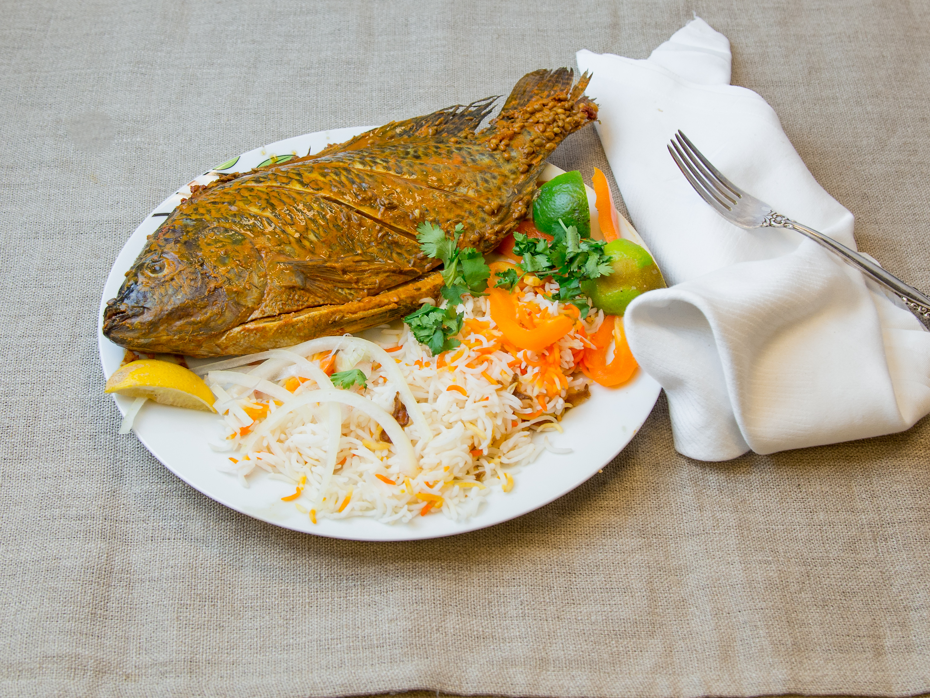 Order Whole Fried Fish food online from Halal Pita Grill store, Chicago on bringmethat.com