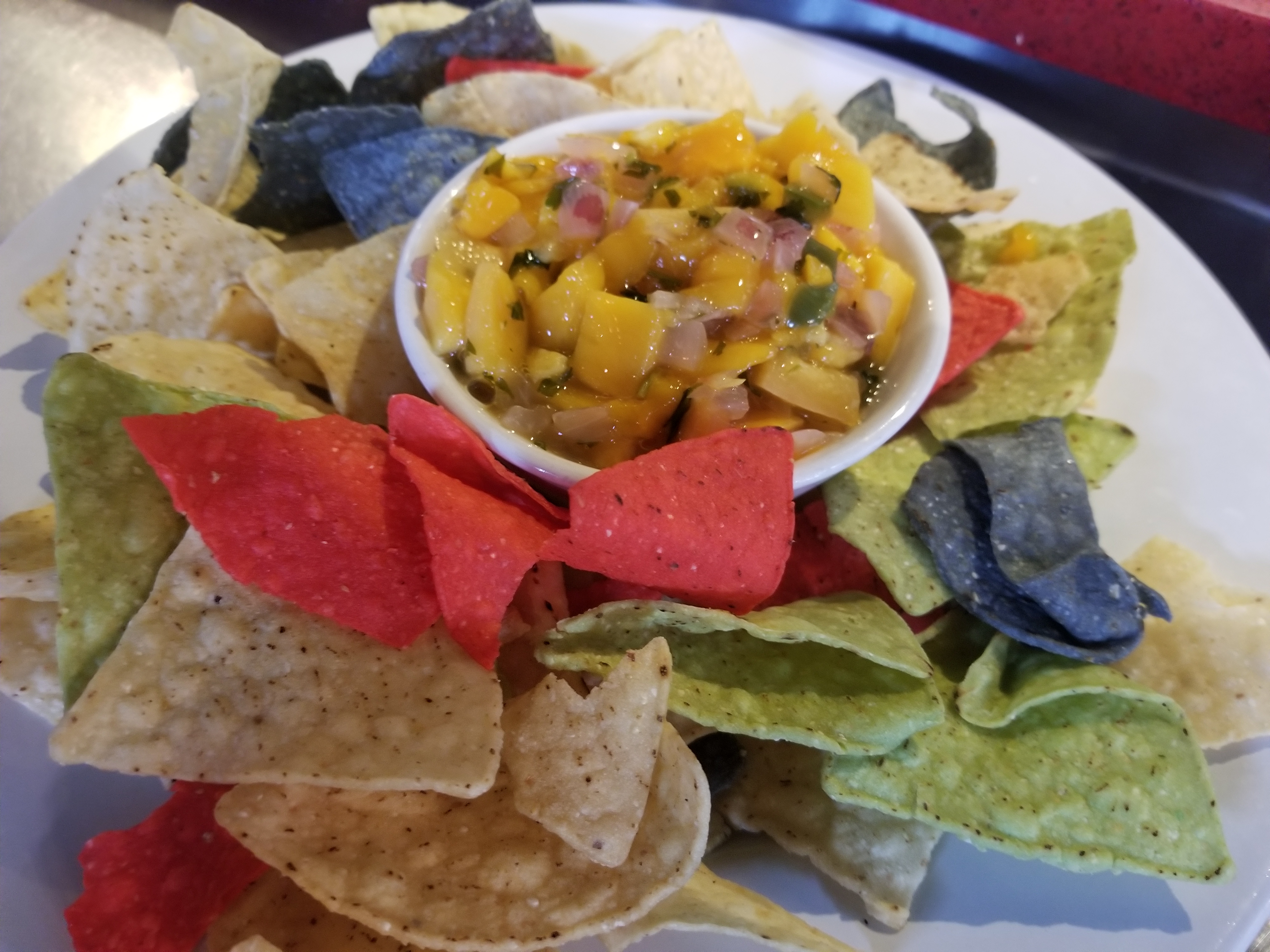Order Mango Salsa with tortilla chips food online from Firefly store, Charlottesville on bringmethat.com
