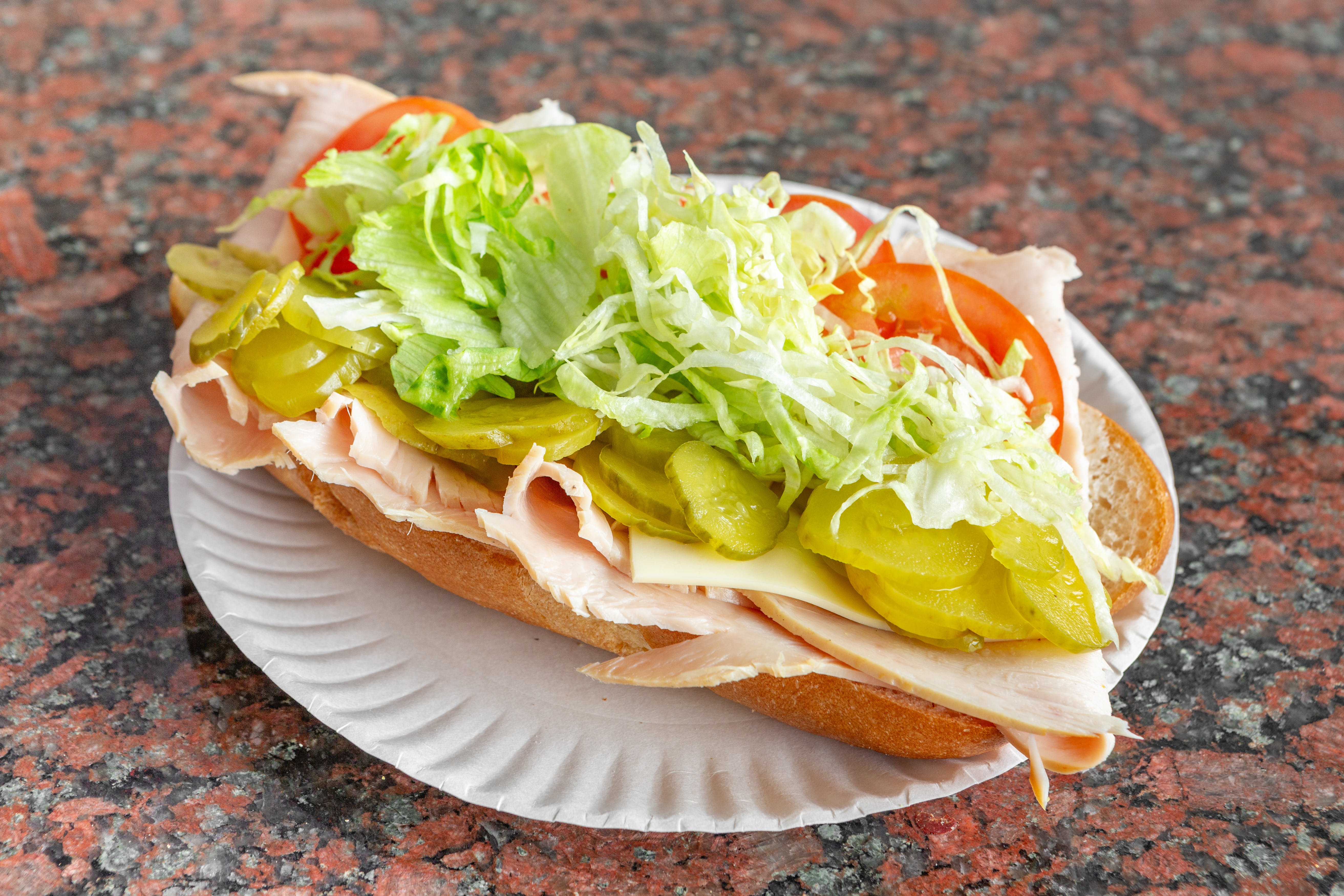 Order Smoked Turkey Sub - Medium food online from Theo's Pizzeria & Grill - Belmont store, Belmont on bringmethat.com
