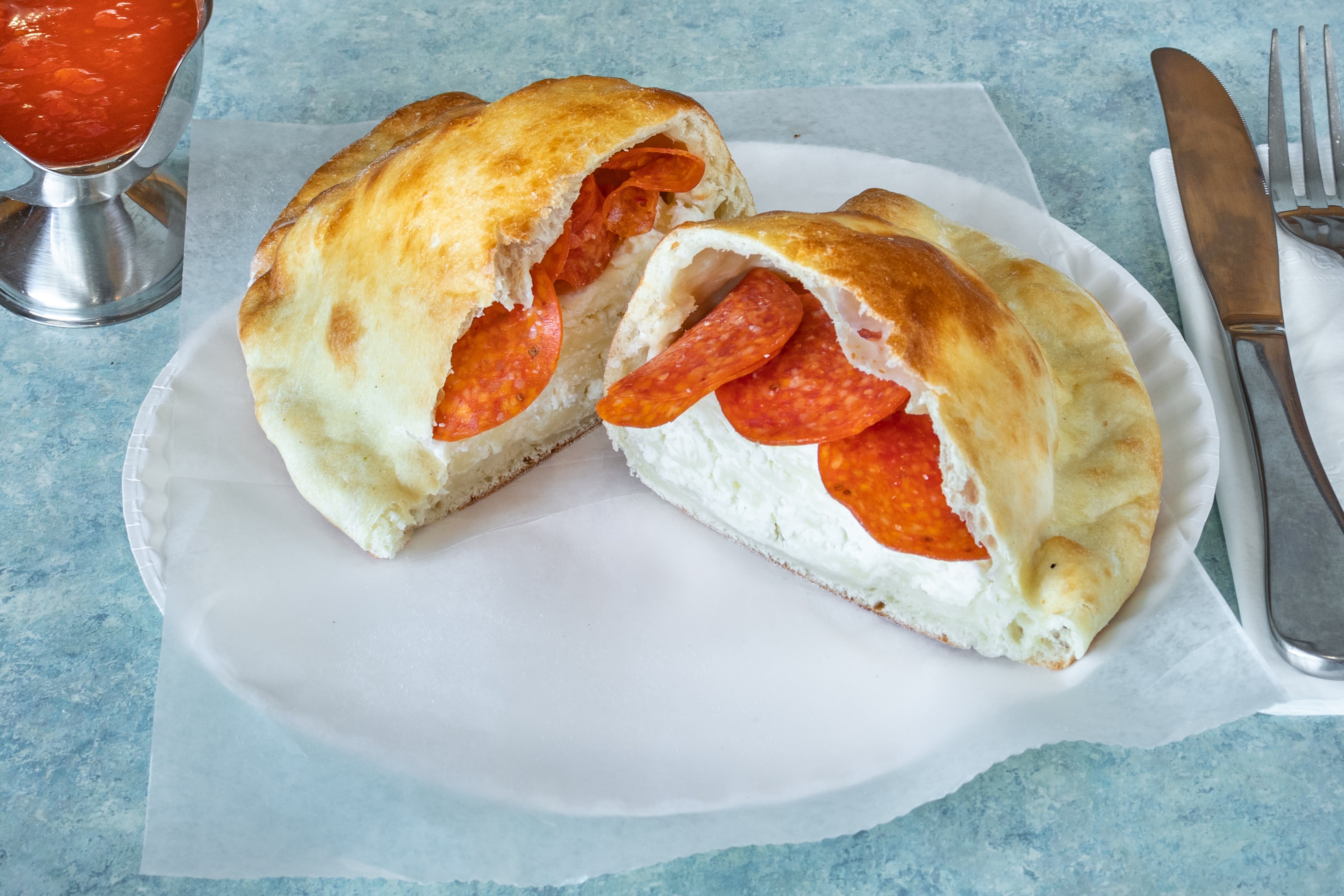 Order Cheese Calzone - Calzone food online from Sinapi Pizzeria store, Brewster on bringmethat.com