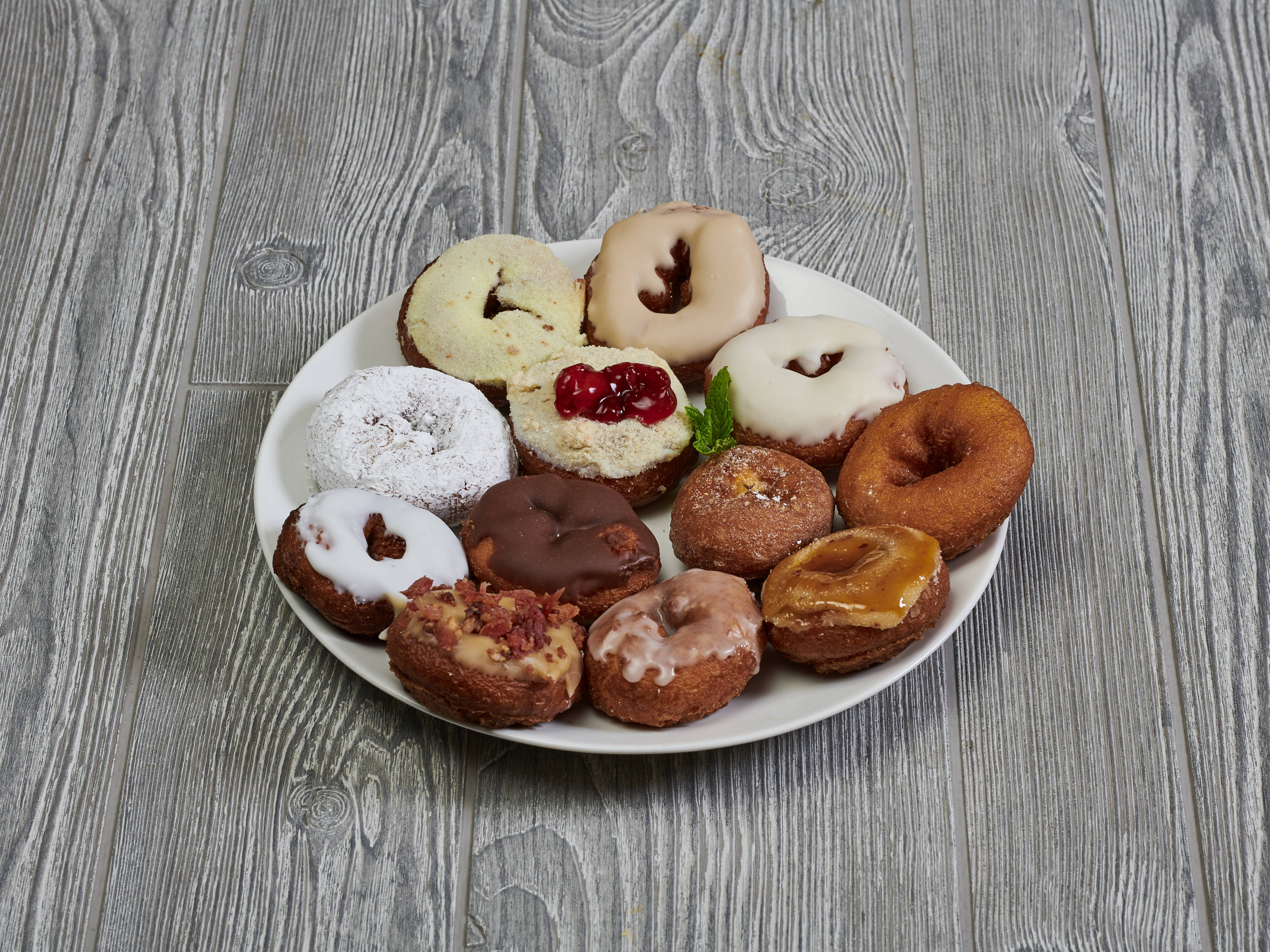 Order Disco Dozen food online from Peace, Love & Little Donuts store, Fort Collins on bringmethat.com