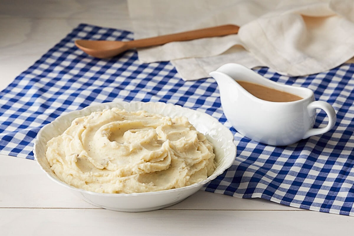 Order Mashed Potatoes w/Brown Gravy food online from Cracker Barrel store, Snellville on bringmethat.com