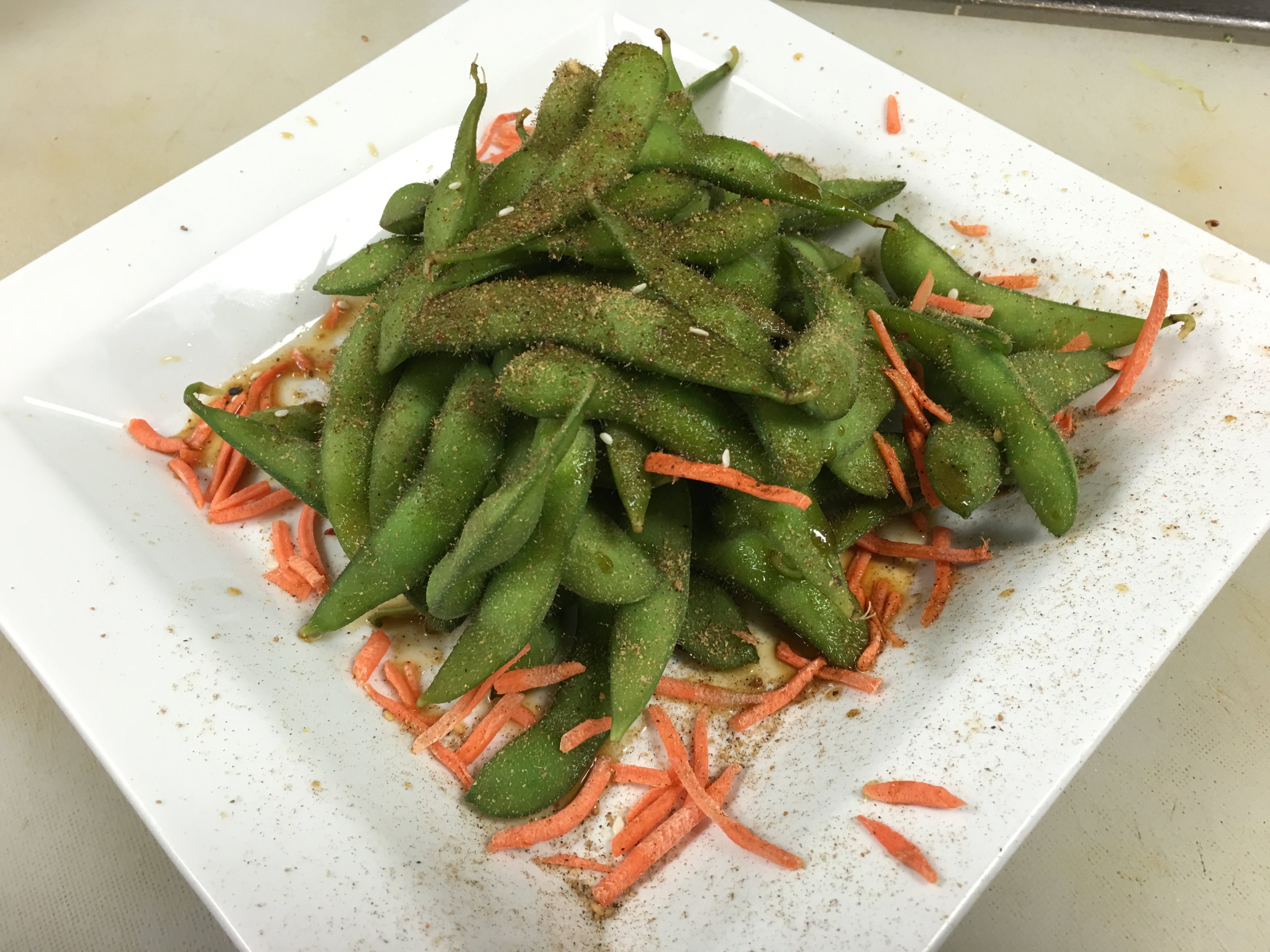 Order Asian Spiced Edamame food online from Shakers Bar and Grill store, Wixom on bringmethat.com