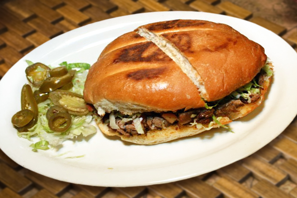 Order Torta al Pastor food online from Taqueria San Miguel store, Cathedral City on bringmethat.com
