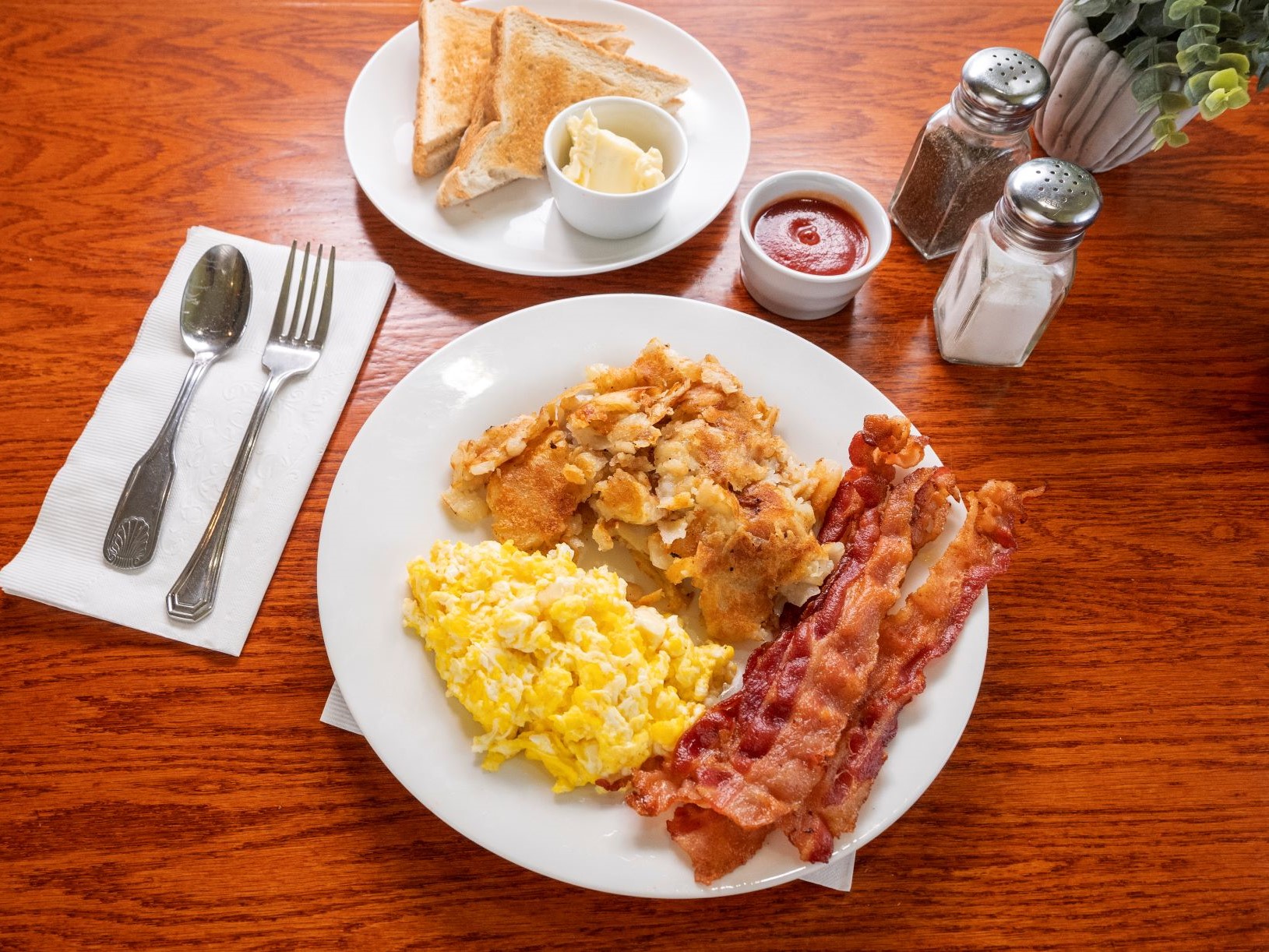 Order 2 Eggs, Choice of Meat, and Grits or Home Fries food online from Mt. Airy Breakfast & Lunch store, Philadelphia on bringmethat.com