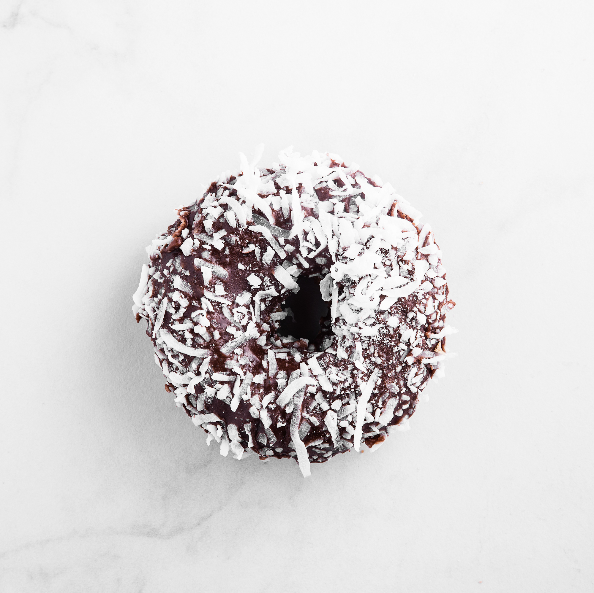 Order Chocolate Coconut Cake food online from Prime Donuts store, Conroe on bringmethat.com