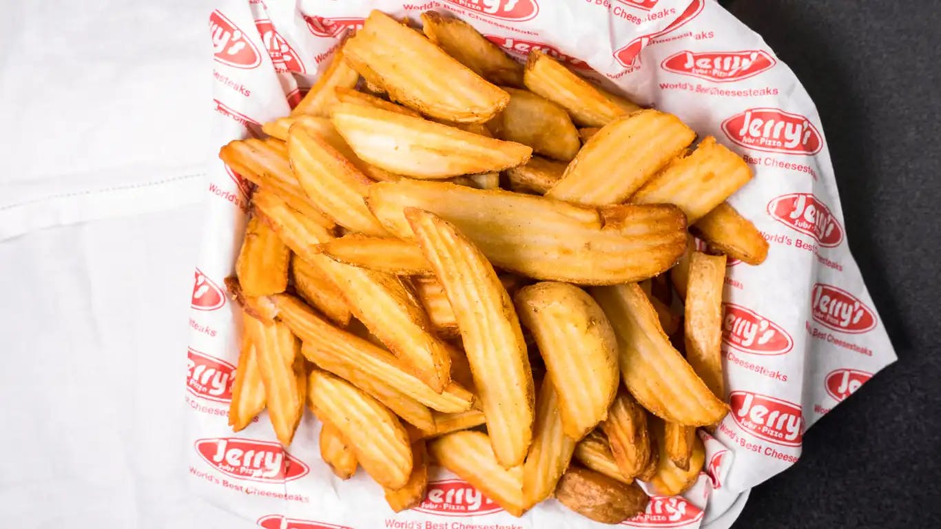 Order Jey's Famous Wedge Fries - Regular food online from Jey Subs & Pizza store, Jessup on bringmethat.com